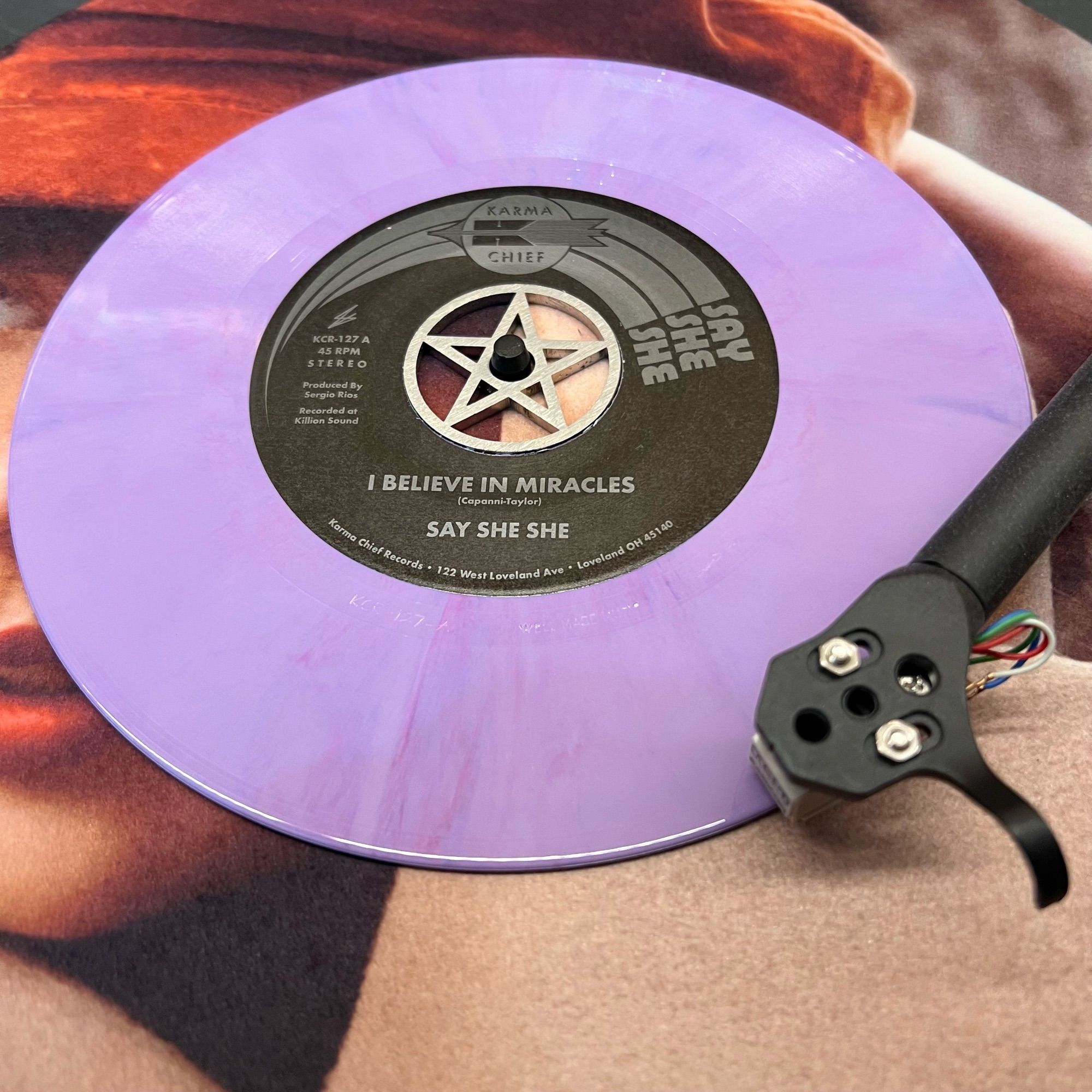 Purple vinyl seven inch single on turntable