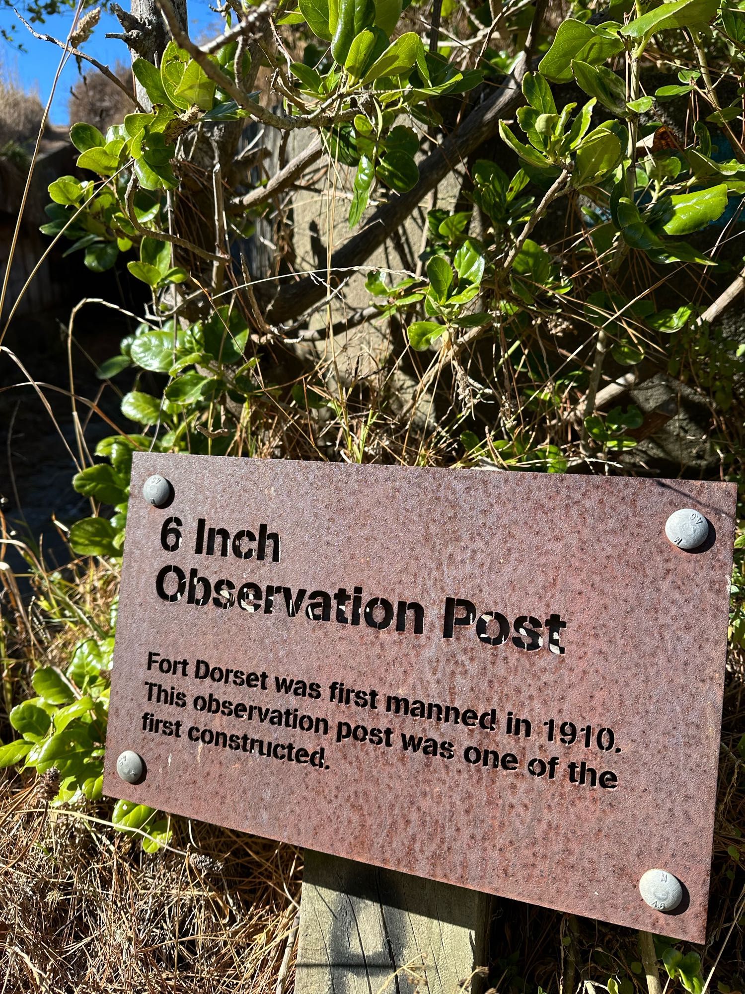 metal sign with letters carved out:  6 inch observation post.  fort dorsett was first manned 👀 in 1910.  this observation post was one of the first constructed.