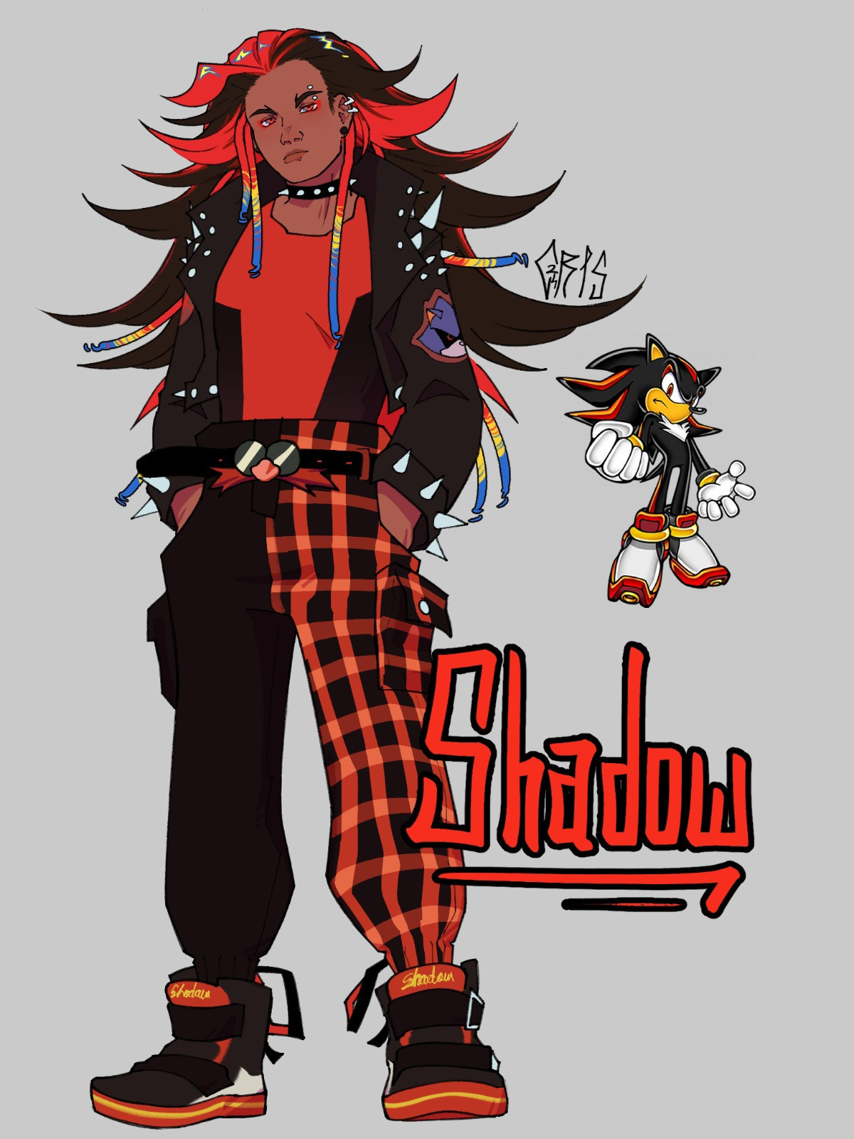 Desenho do Shadow o ouriço humano. Sua pele é escura, seu cabelo é bagunçado e espetado nas cores preta e vermelha, com alguns dreads com pontas amarelas e azuis. Suas roupas são inspiradas no estilo punk com espinhos e padrões.