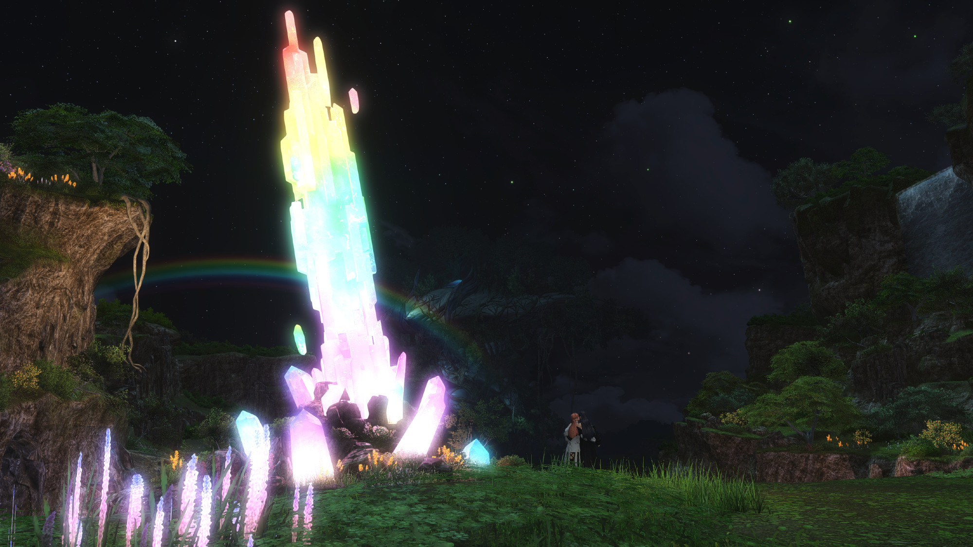 Ryne and Gaia standing near the rainbow crystal in Eden at night