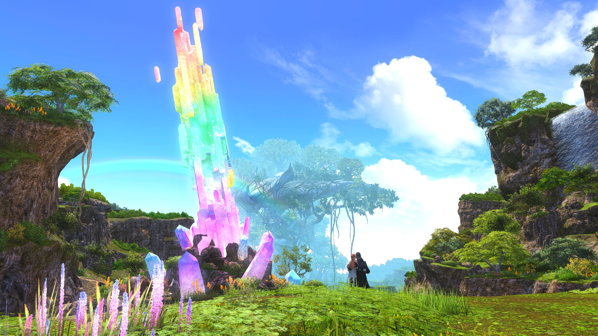 Ryne and Gaia standing near the rainbow crystal in Eden in the daytime