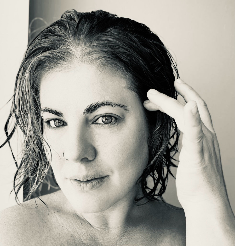 Femme from the shoulders up  —Black and white selfie with wet hair, fresh out of the shower