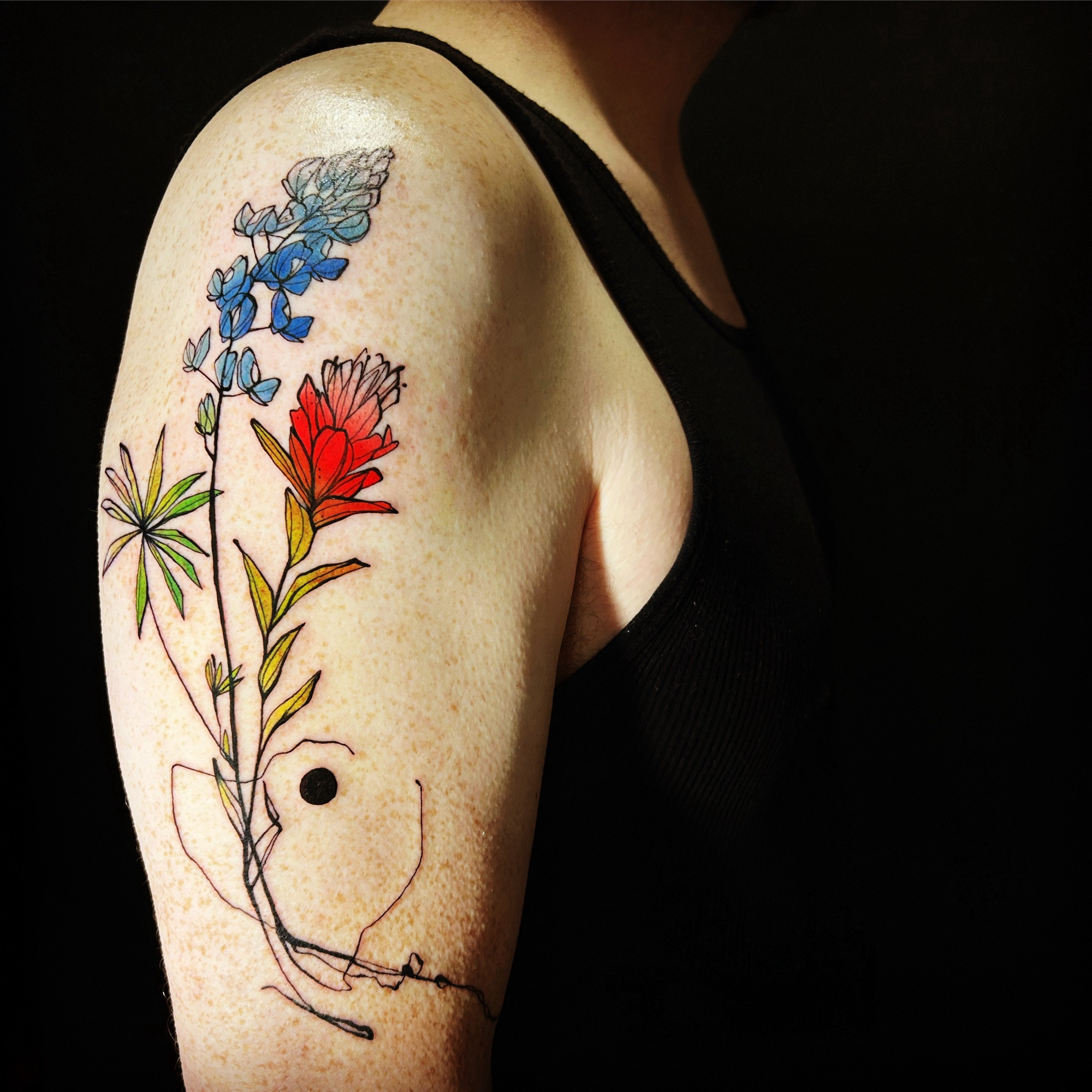 arm tattoo of texas wildflowers