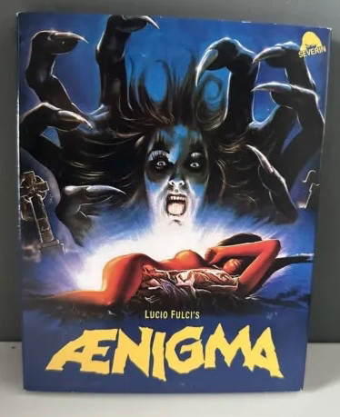 movie poster for lucio fulci's ænigma (1987), featuring medusa w fingers for hair, and a sleeping lady w one tit hanging out