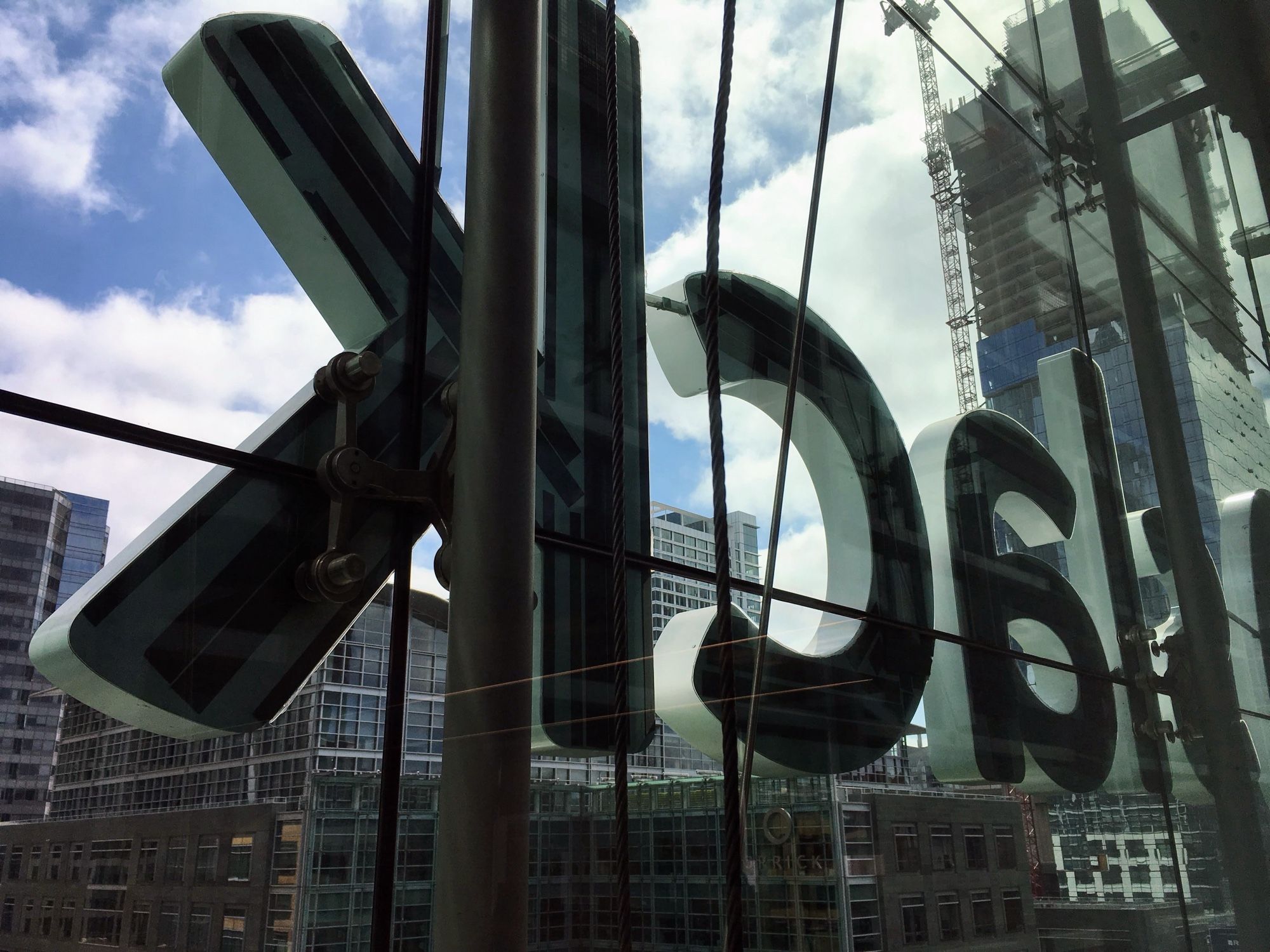 Photo of the old Slack logo affixed to a glass window taken from inside