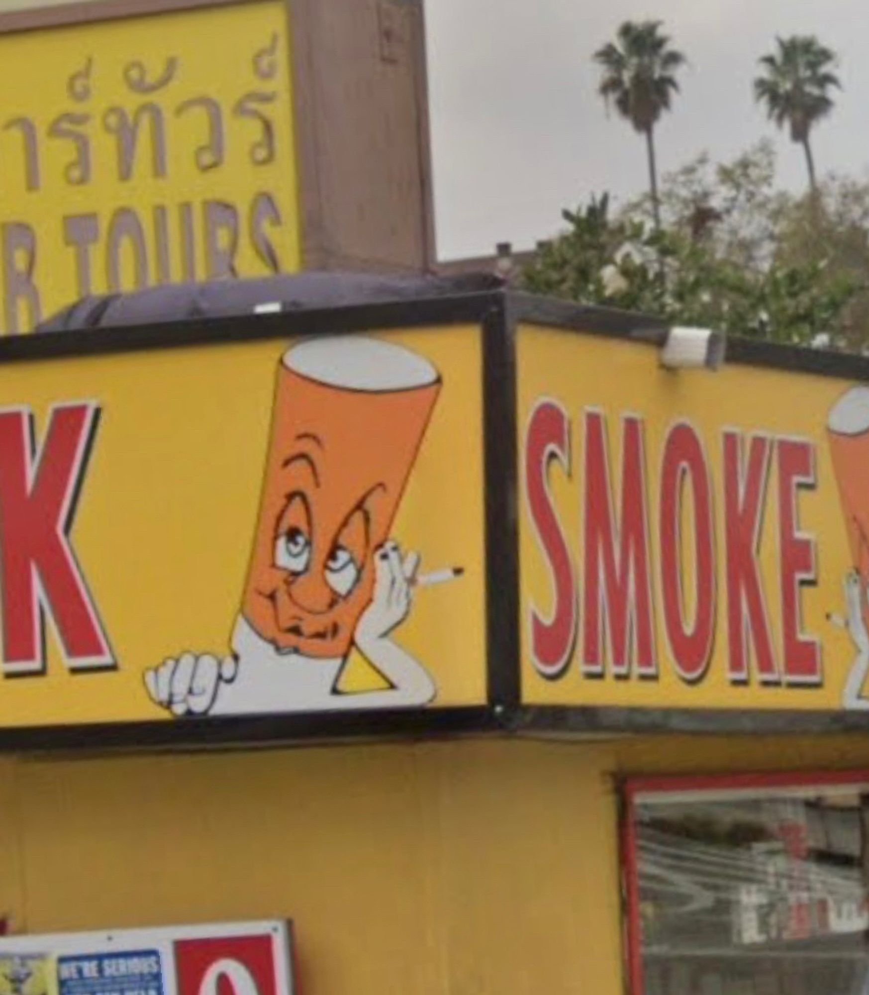 A sign on a cigarette smoke shack in LA featuring a humanoid cigarette that looks like John Boehner smoking a cigarette