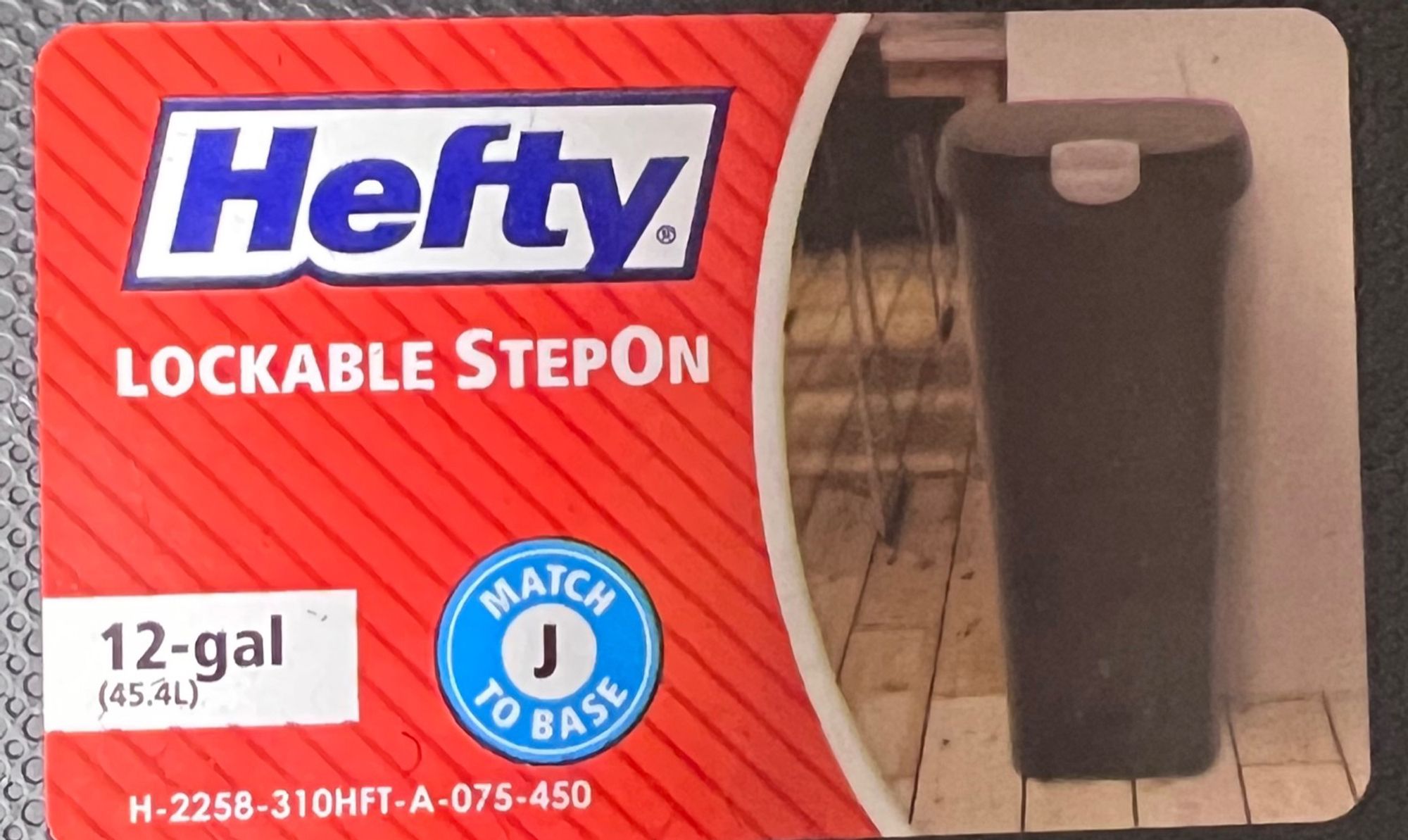 Image of a trash can label that says “Hefty Lockable Stepon”