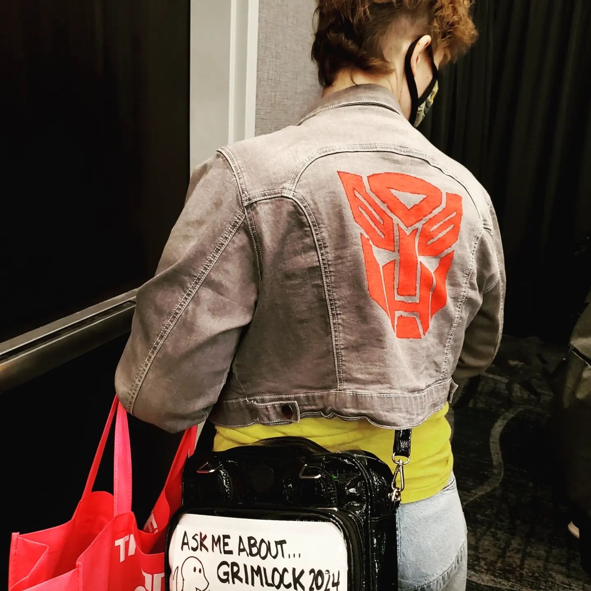 Showing off the back of my Transformers battle jacket with the Autobot logo painted on it.