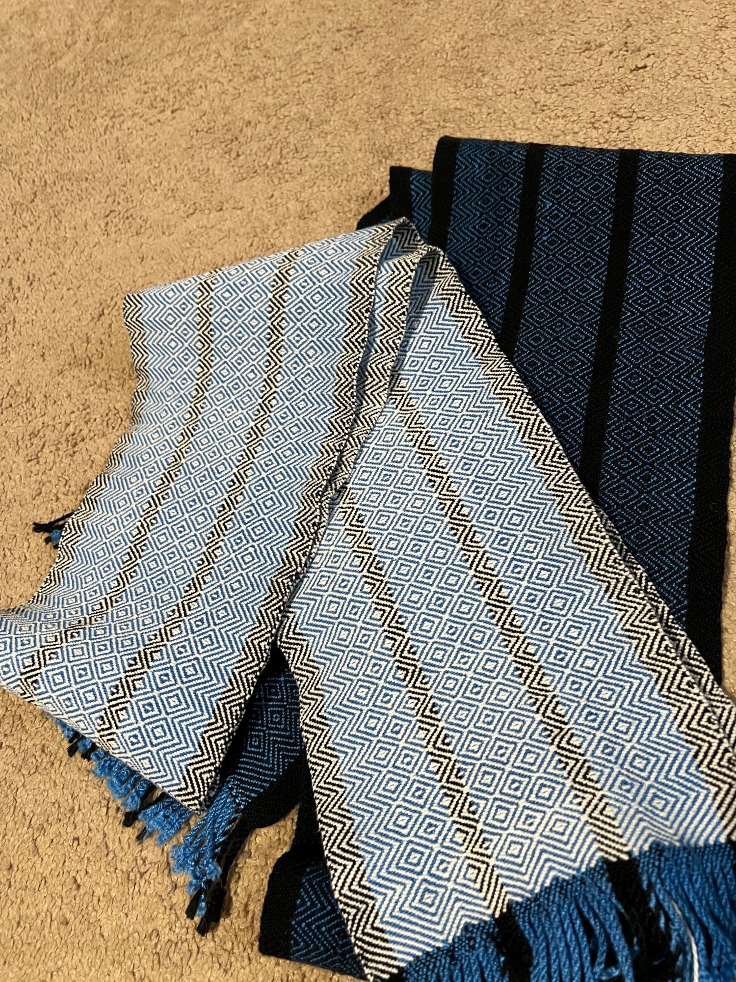 Alternate version of black and blue striped scarf using a white weft yarn so the white diamond twill pattern dominates the design, laying over black and blue version for comparison