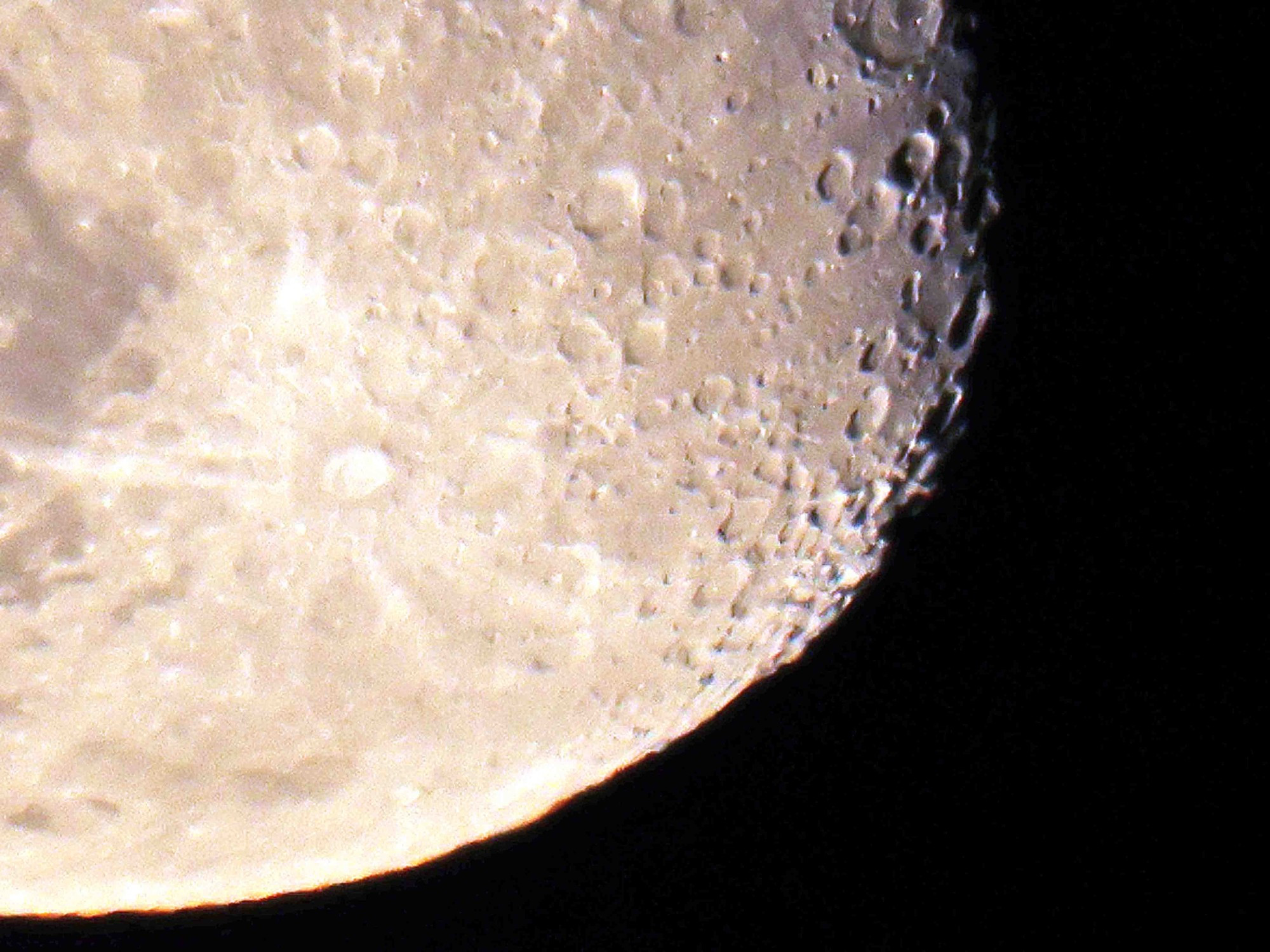 Detail of the bottom right of the waning gibbous moon. 
I am starting to think of the deep crater in the middle as a belly button.