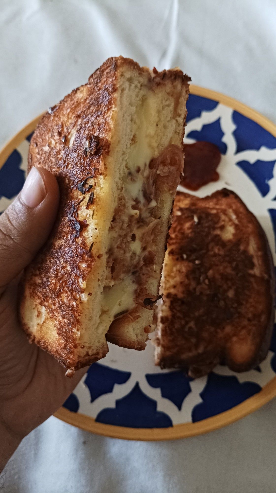 Same sandwich tilted to show the grilled crumb.