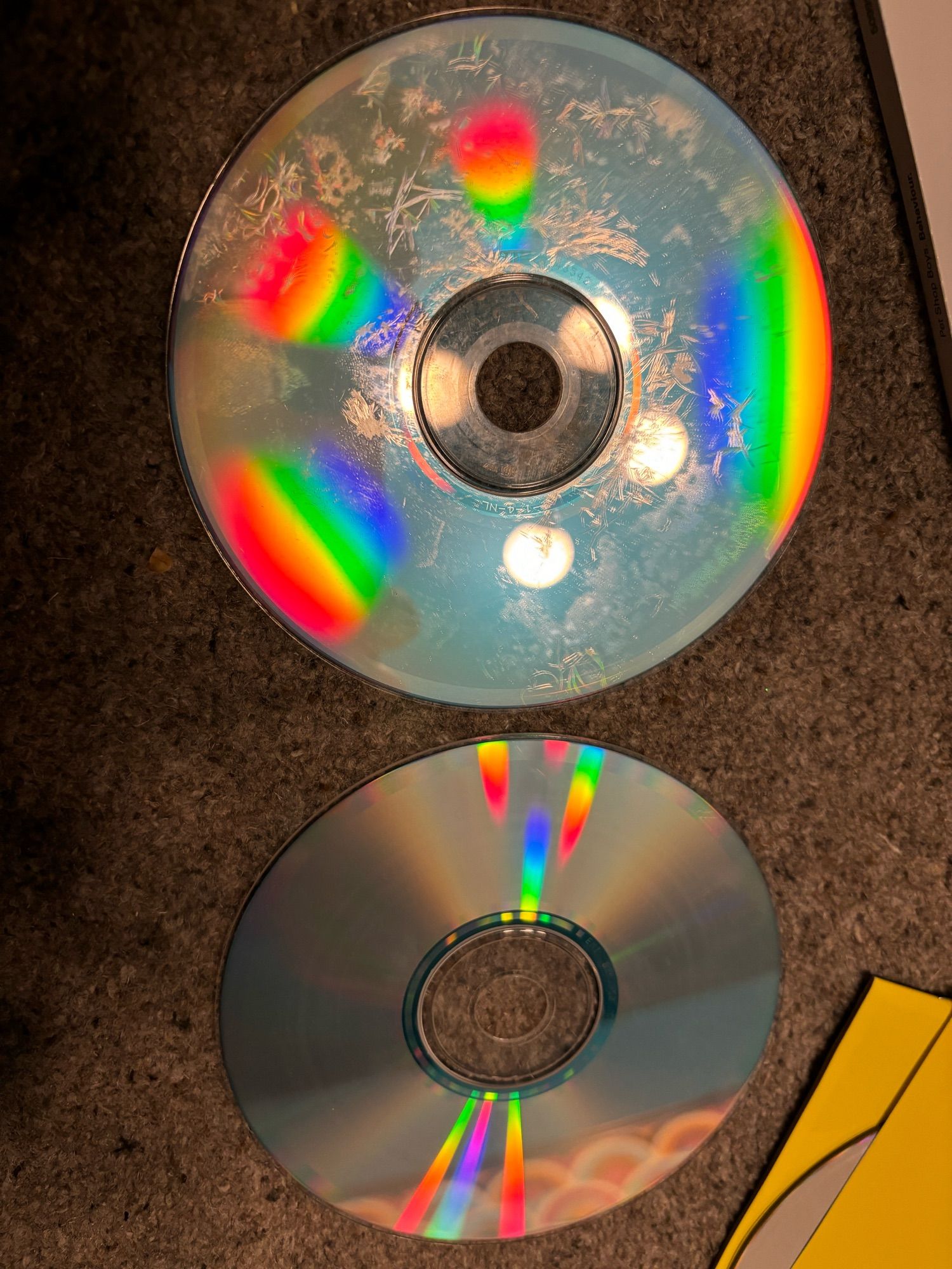 2 compact discs, one ruined with some kind of disc rot, the other fine.