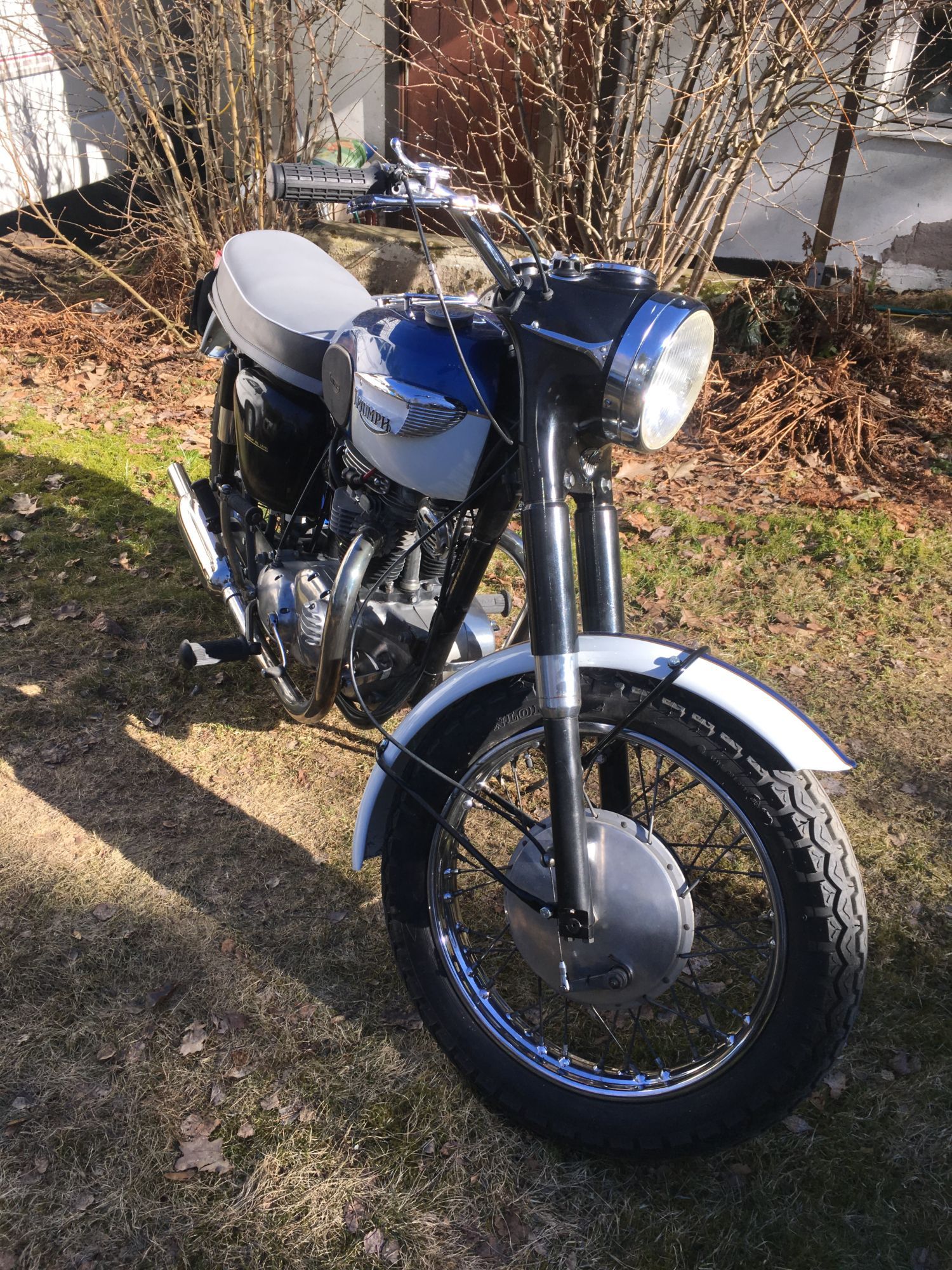 Front right view of a restored 1966 Triumph Thunderbird 650cc motorcycle.