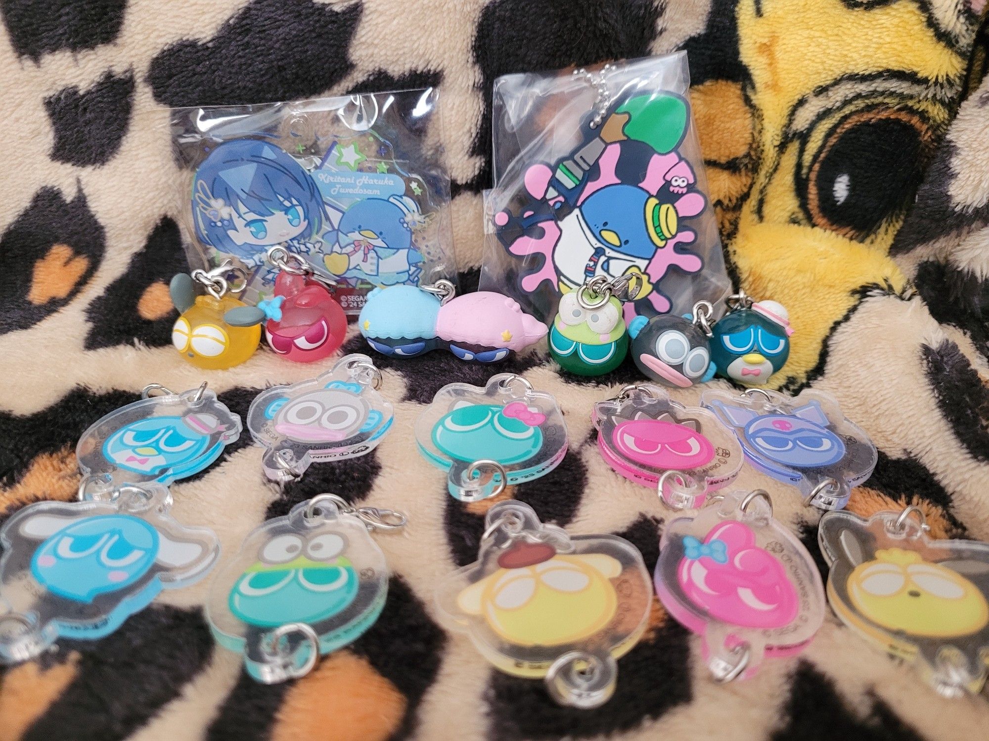 Collection of keychains - Project SEKAI Haruka and Tuxedosam, Splatoon 2 Tuxedosam and two sets of Puyo Puyo x Sanrios keychains.