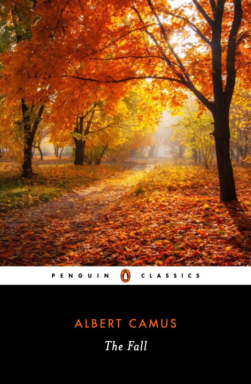 Penguin classics cover of The Fall by Albert Camus. the cover image is autumn leaves covering the ground, low sun peeking through trees still bearing yellow and orange leaves