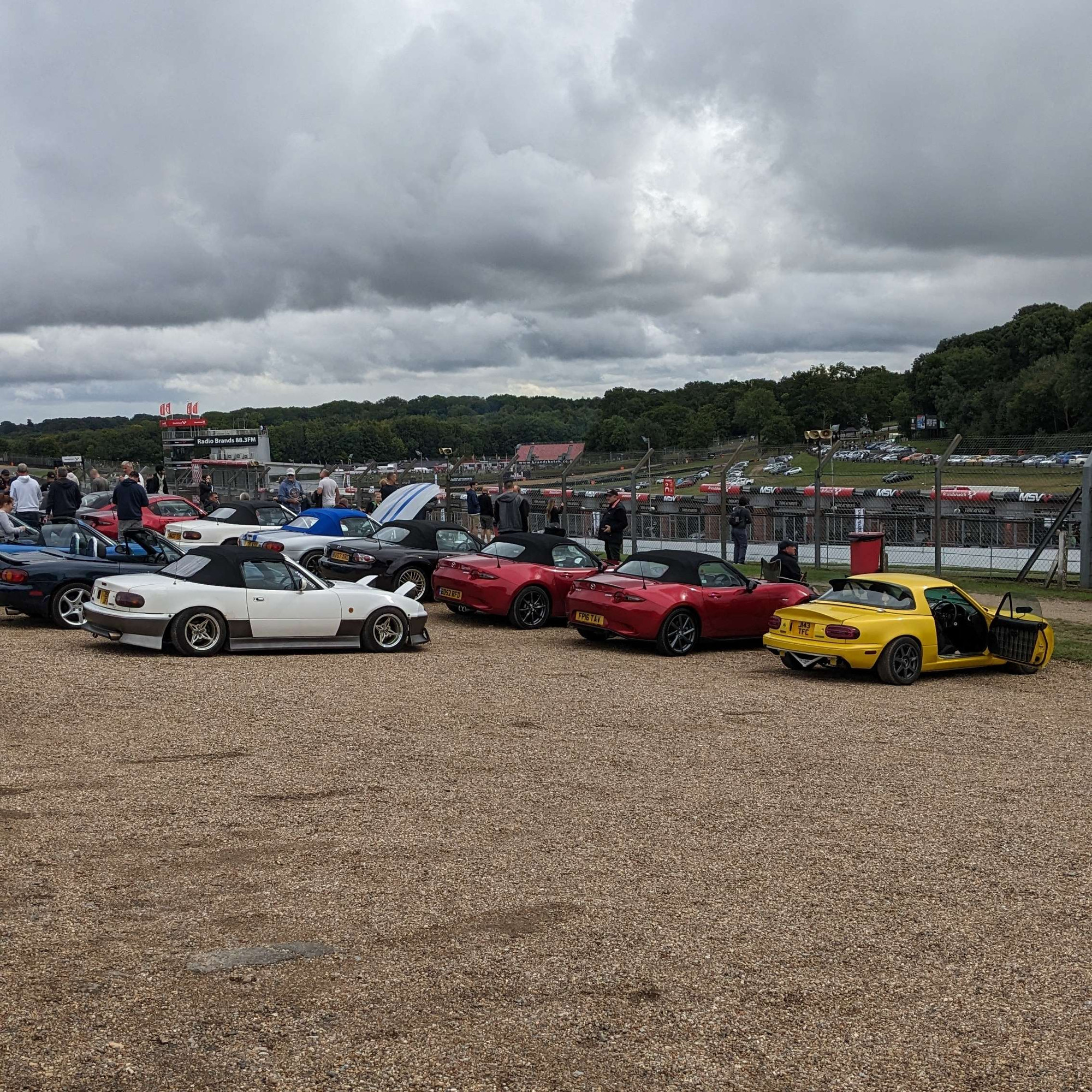 Many Mazda MX-5s overlook Brands Hatch Circuit.