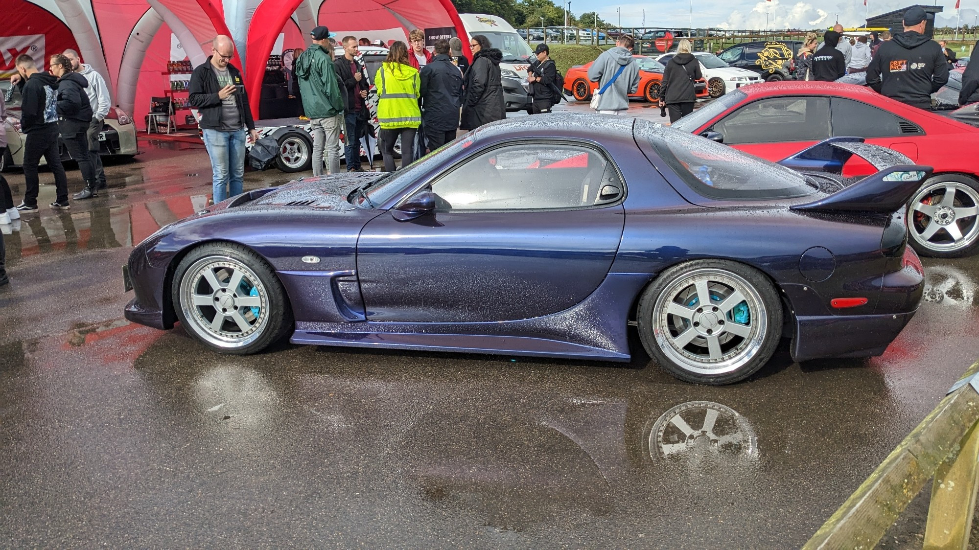 A colour-shift purple Mazda RX-7 (FD) on TommyKaira wheels