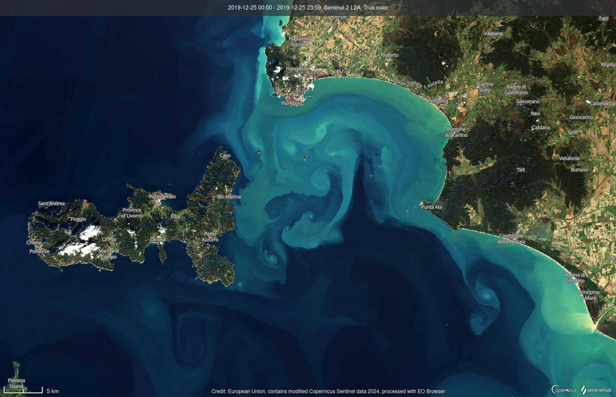 A view of the sea from satellite. Land is in brown/green, the sea in shades of blue. The lighter blue shades swirl around due to ocean currents. Image from the EO browser.