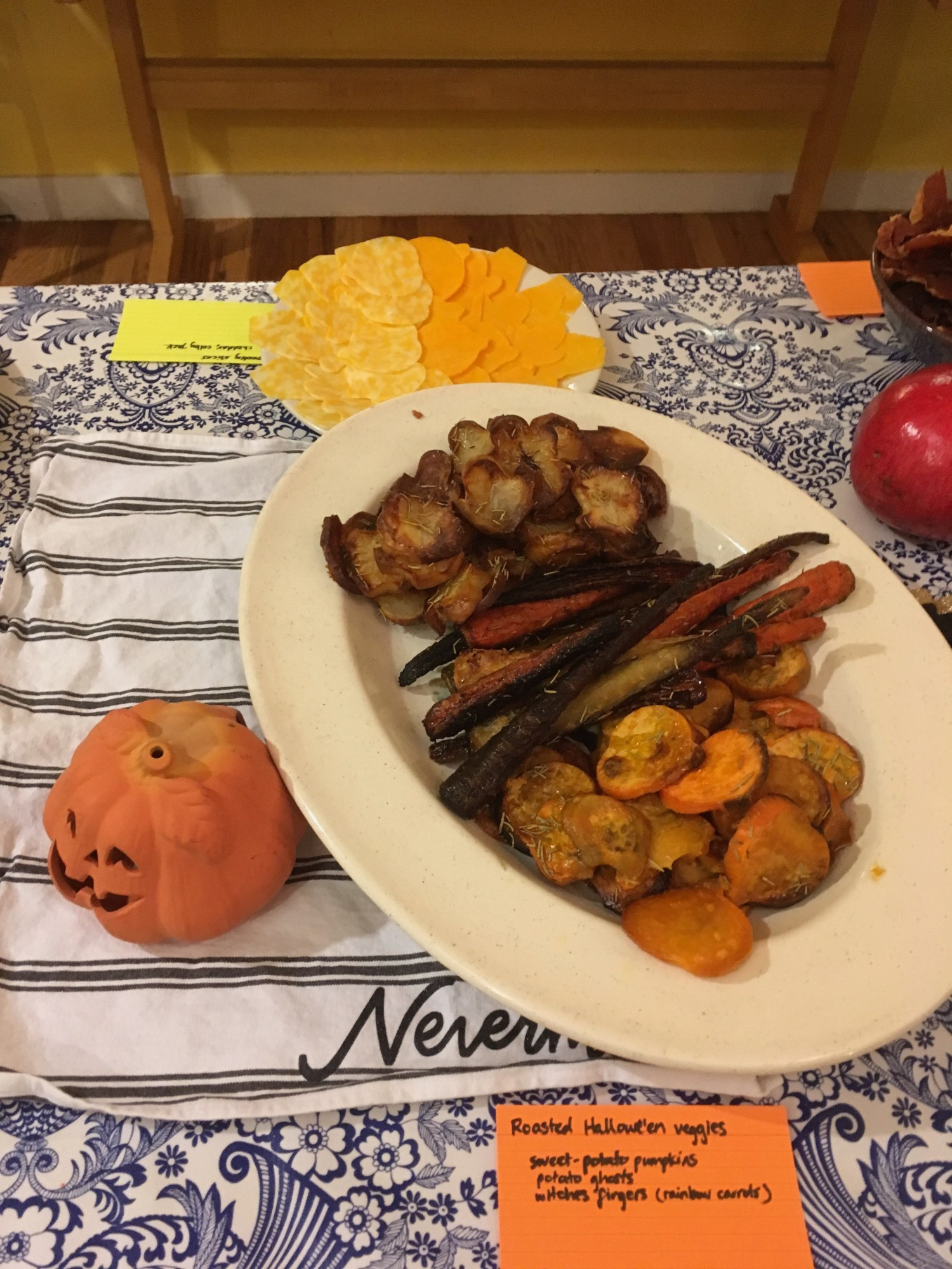 Cheese slices cut into pumpkin shapes; roasted Hallowe'en veggie slices -- sweet-potato pumpkins, potato ghosts, "witches fingers" (rainbow carrots).