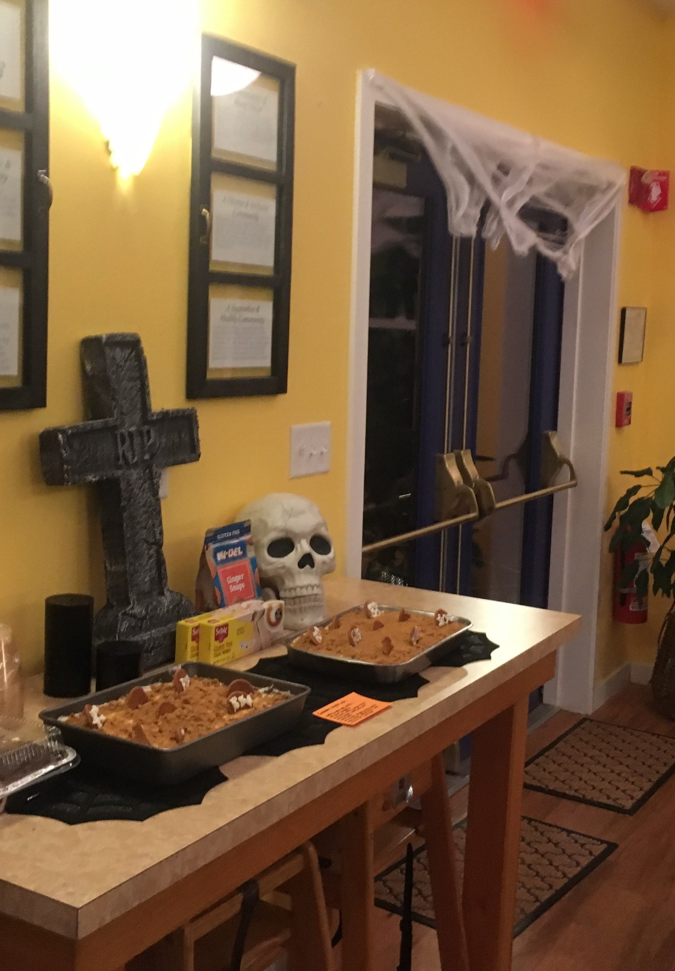 "Graveyard cakes" topped with cookie tombstones and dirt made of crumbs. 