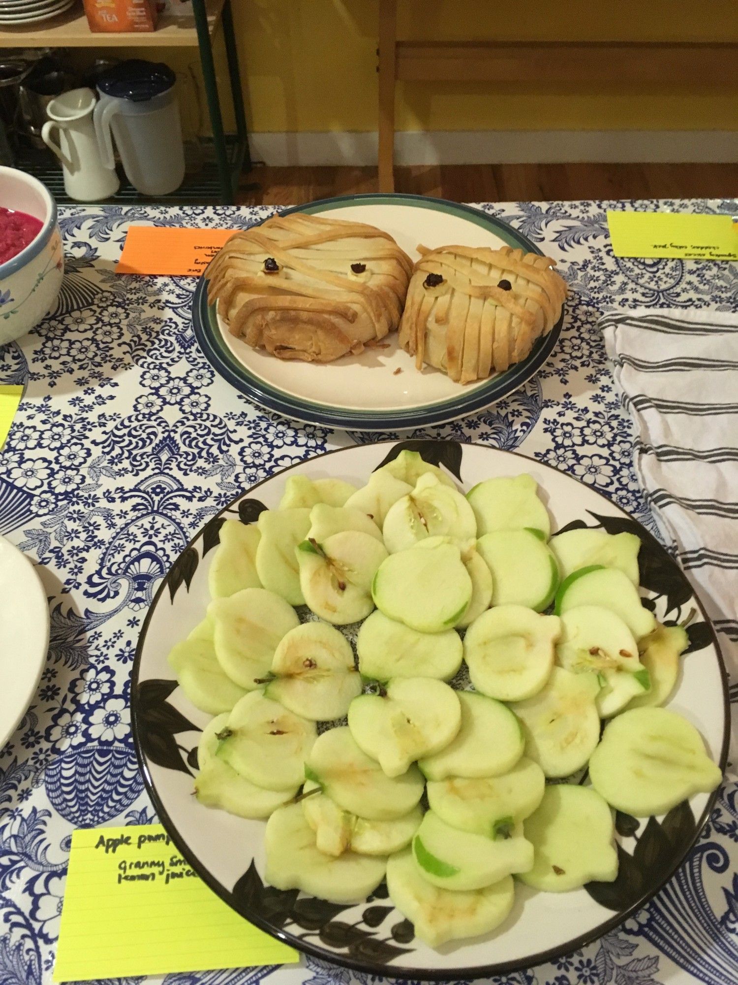 Apple pumpkins (apple slices cut with a pumpkin-shaped cookie cutter); mummified Brie (baked Brie draped in strips of puff pastry, with added "eyes").