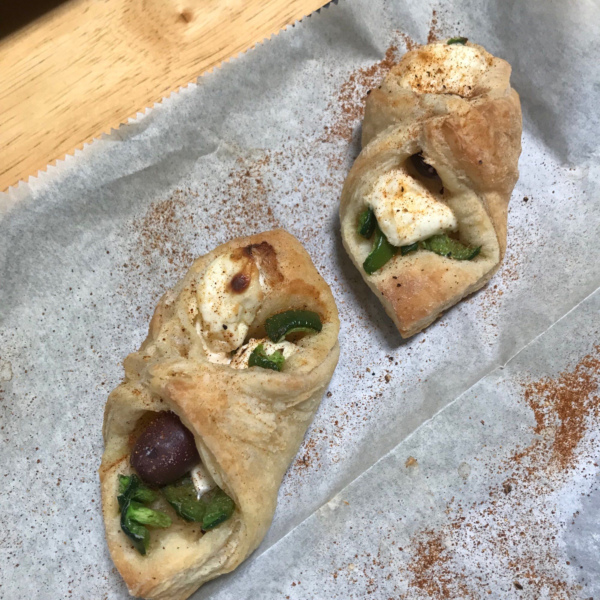 Two Puff pastry envelopes jalapeño, kalamata olive and cream cheese