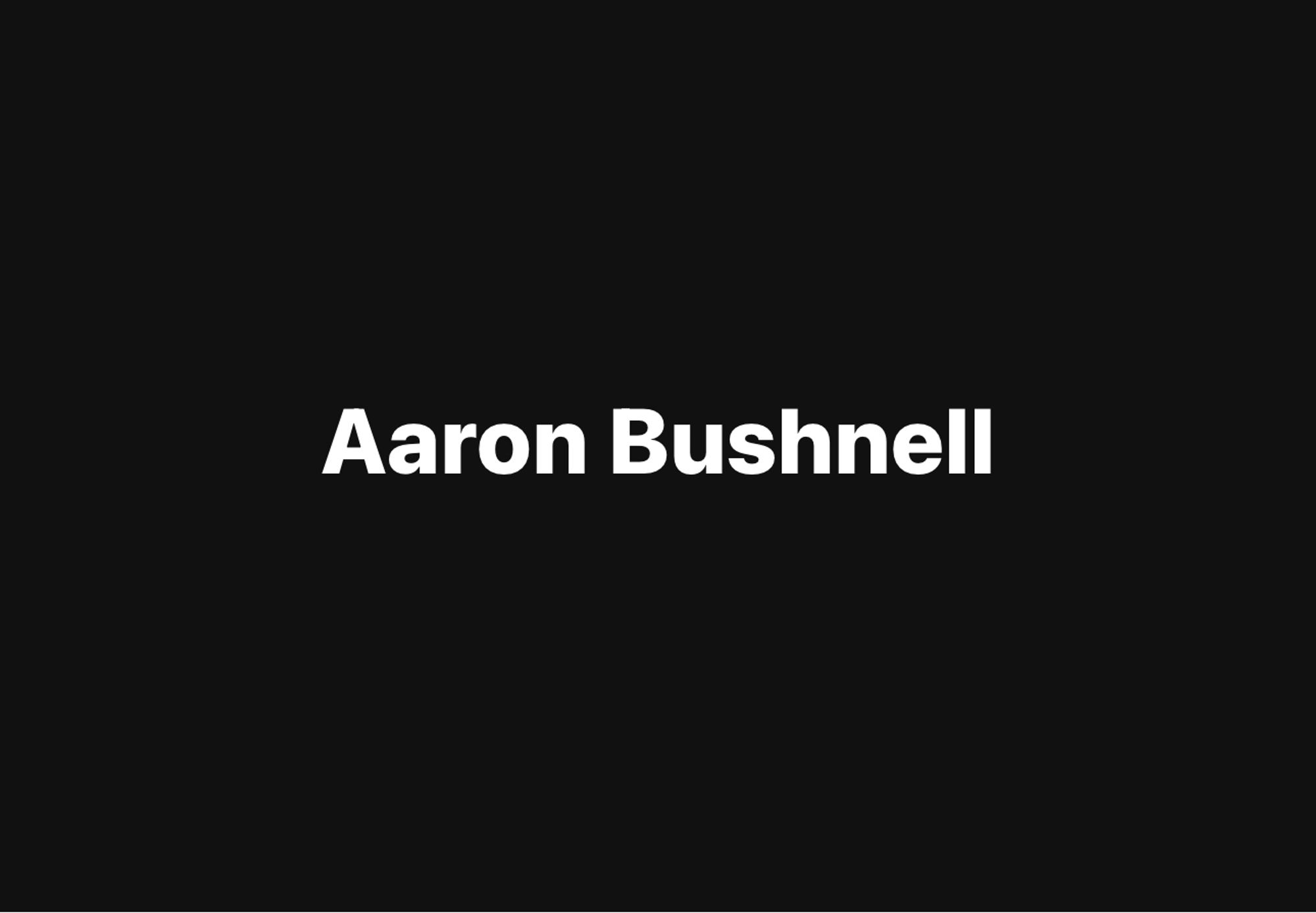 Aaron Bushnell printed in bold white letters on a black background.