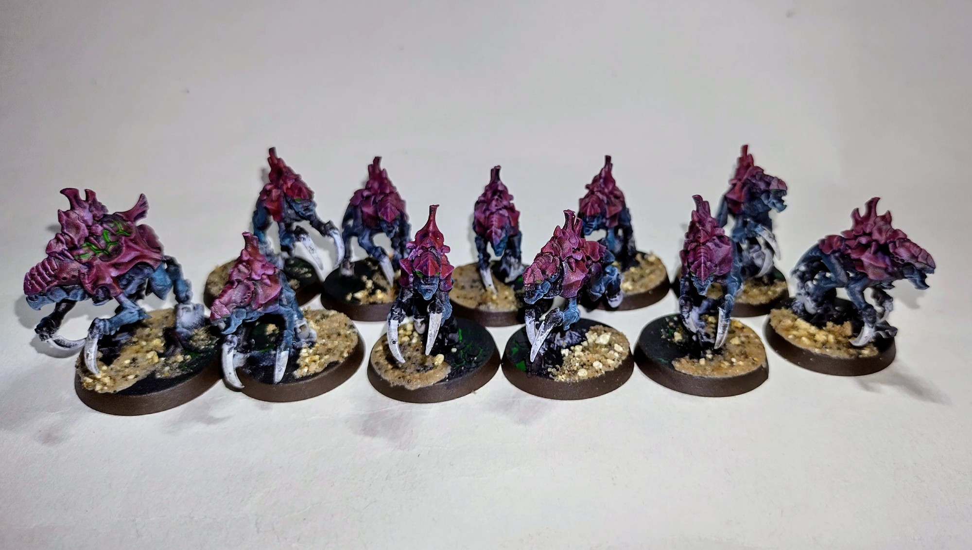 All the Neurogants painted for my Tyranids. Red /purple carapace and blue-highlighted black skin. 