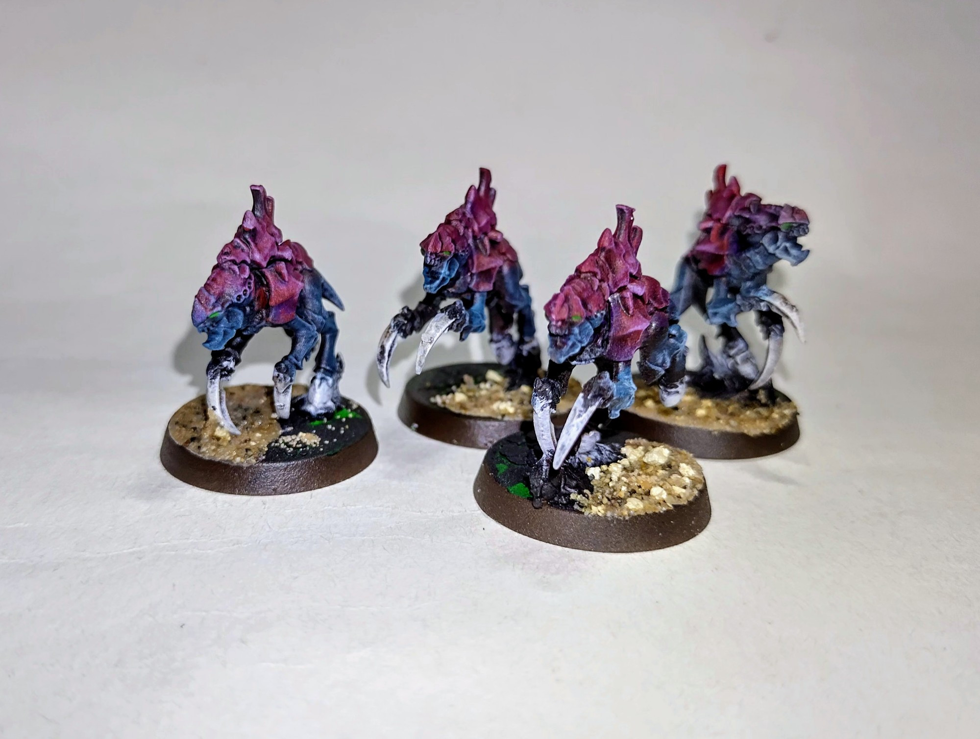 A few Neurogants for my Tyranids. Red /purple carapace and blue-highlighted black skin. 