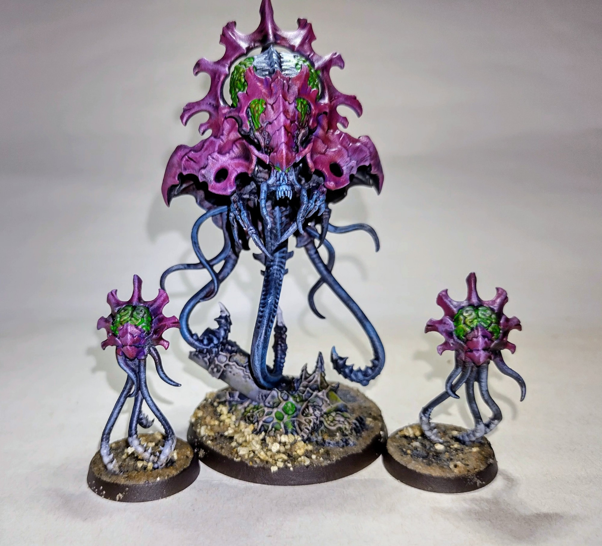 Tyranid neurotyrant painted with dark red/purple chitin and blue/black body