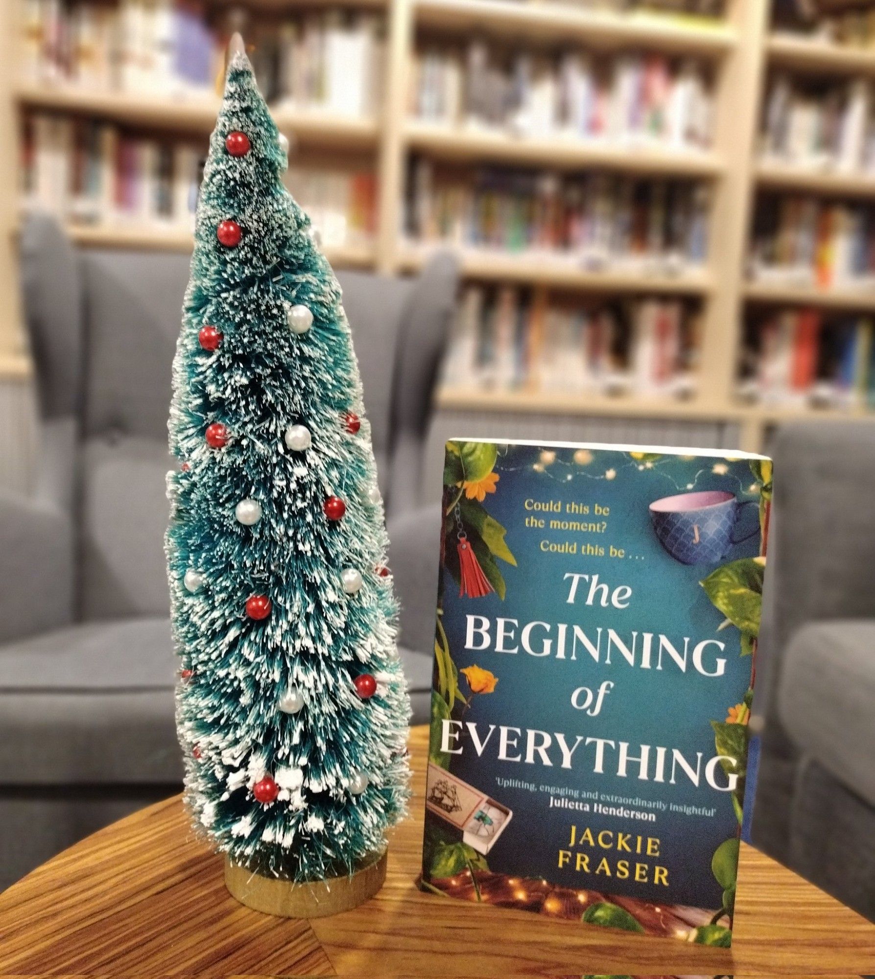 A festive scene at Simon & Schuster, featuring my book The Beginning of Everything and a little Christmas tree