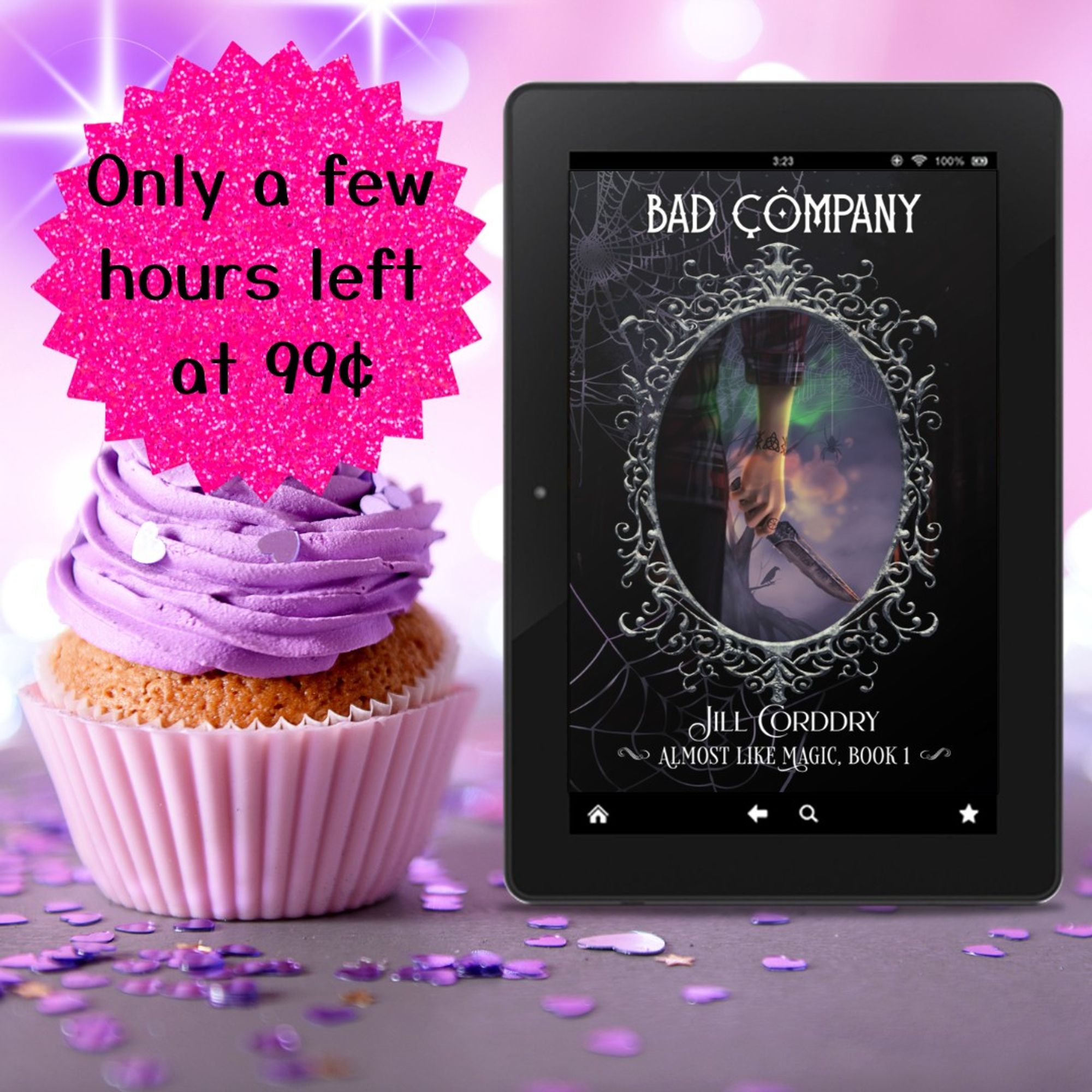 Image is a birthday celebration! The background is pale purple with bright glittery white flares. In the forefront is a vanilla cupcake in a purple cupcake paper and with tall purple frosting...both match the background. Purple heart confetti is strewn about the darker purple table. To the right of the cupcake is an e-reader with the cover of Bad Company: Almost Like Magic, book 1, by Jill Corddry (hi! that's me!) In bold black curly font in the upper left corner reads: Only a few hours left at 99¢ The text is on a sparkly hot pink glittery-looking sticker.