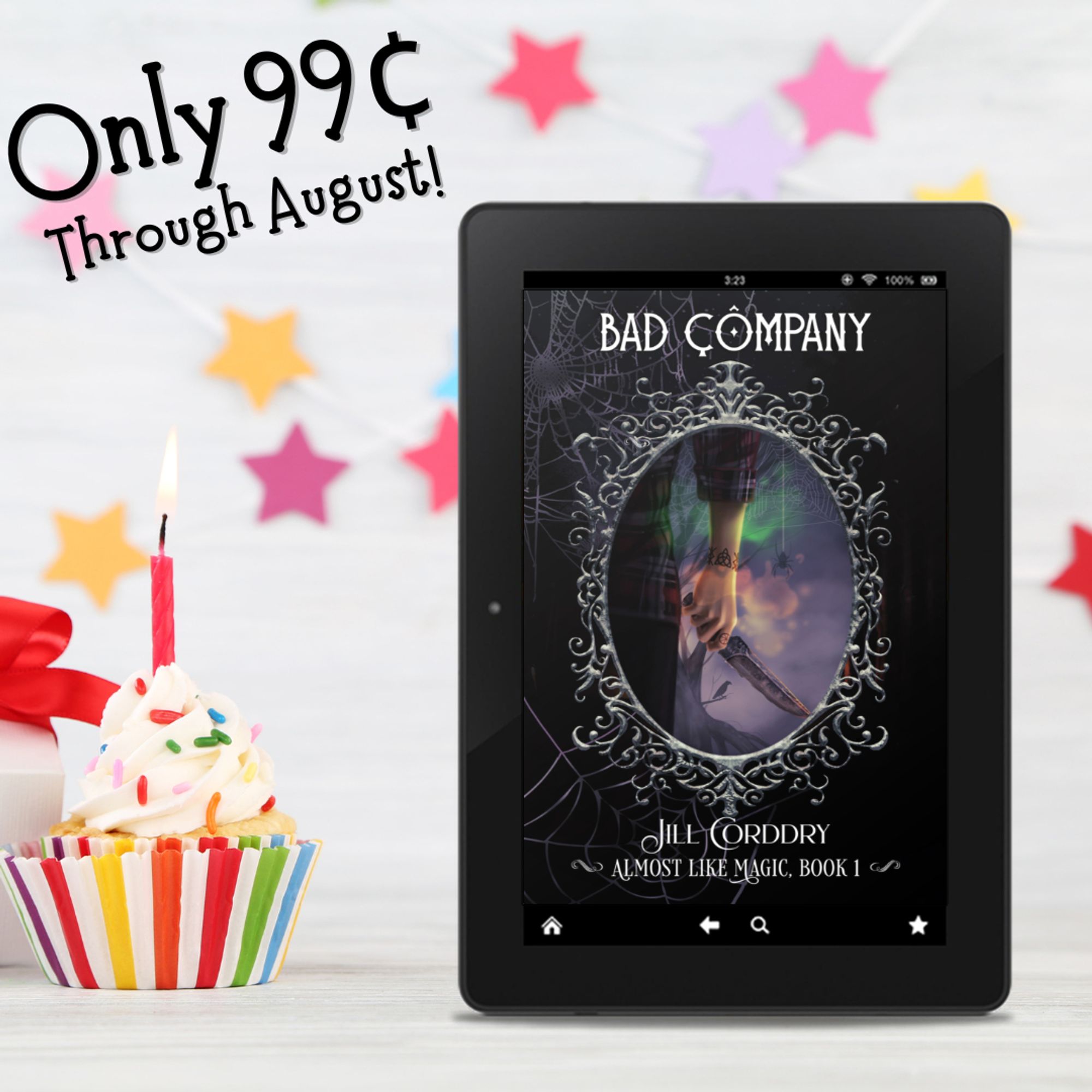 Image is a sale announcement. The background is white with bright colorful five-point stars hanging on white strings. At the bottom left, is a vanilla cupcake with vanilla frosting is in the forefront. It's in a rainbow striped paper and has a lit red candle in it.  On the right is an ebook reader displaying the cover of Bad Company: Almost Like Magic, book 1, by Jill Corddry (HI! That's me!). In the upper left, in a slightly loopy black font reads: Only 99¢ through August!