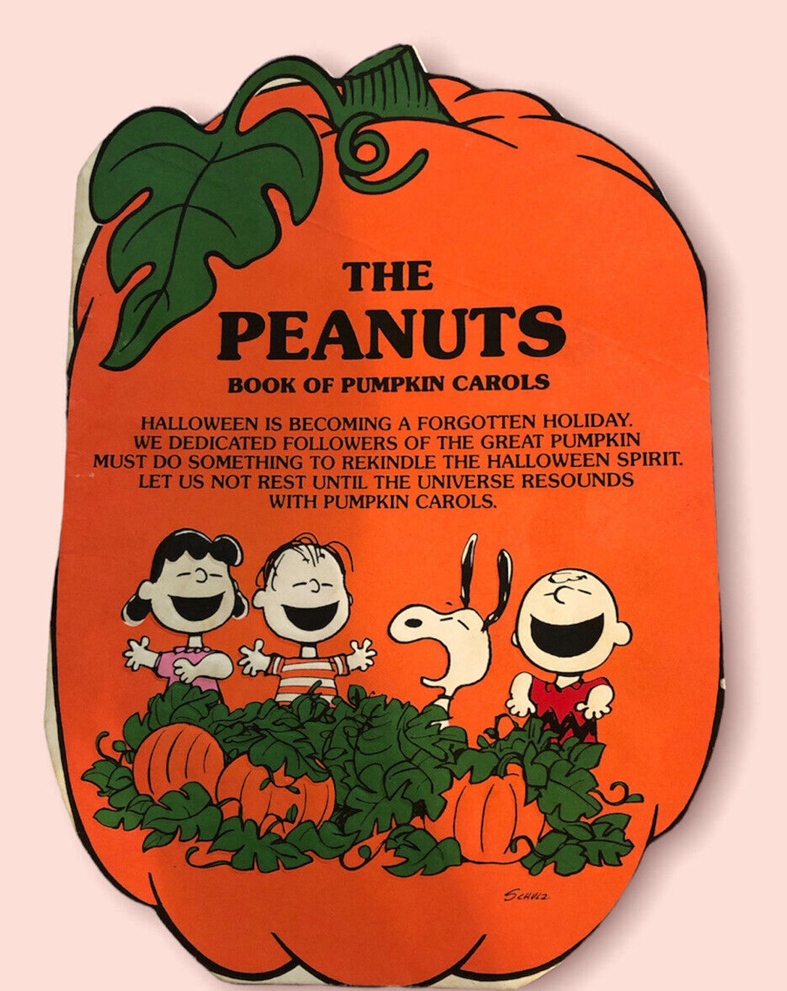 A 40-some-year-old foldout greeting card called The Peanuts Book of Pumpkin Carols featuring Peanuts characters singing. Among pumpkins.