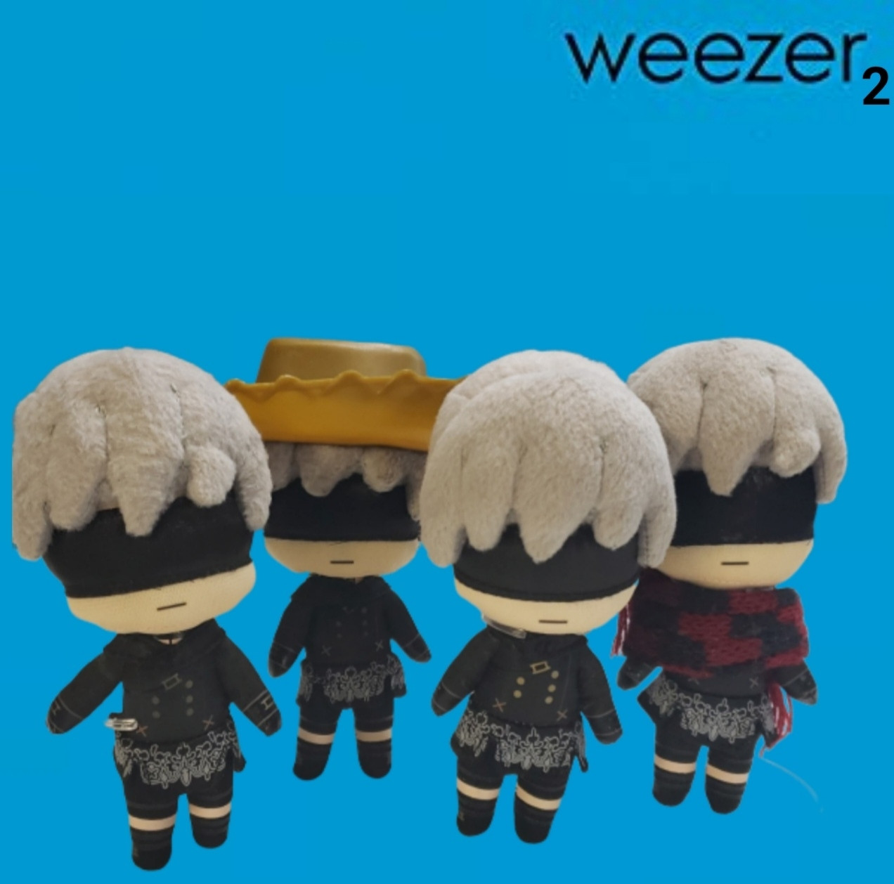 4 Plushies of the character 9S from Nier: Automata standing side by side in a blue background similar Weezer's Blue Album cover. The corner of the picture also marks this as an album cover from "Weezer 2"