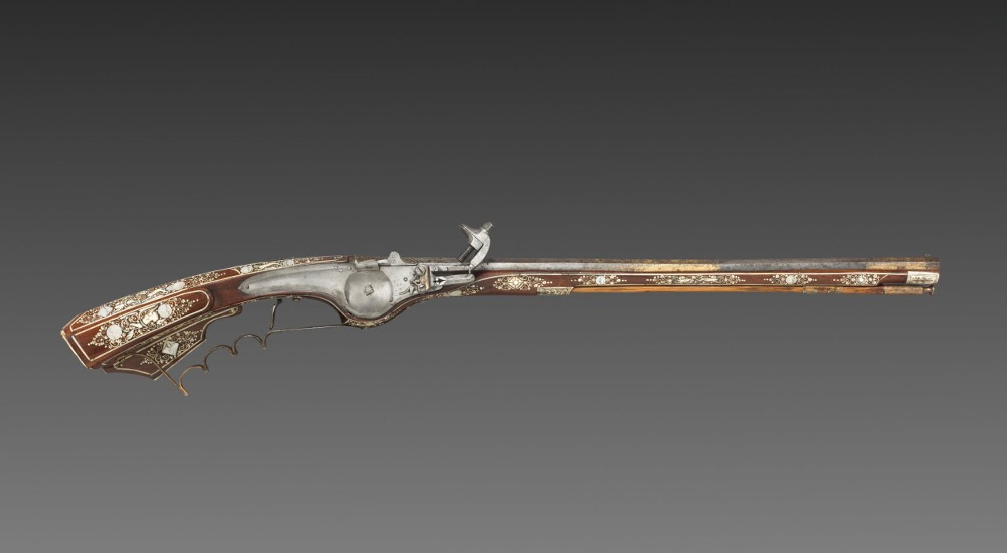 A petronel was a type of long pistol made with a wheel-lock ignition. Despite its length, the petronel was fired at the wrist like a pistol and not at the shoulder like a rifle. They were generally made in pairs during the early 1600s. Civilian versions were elaborately decorated for aristocratic clients.