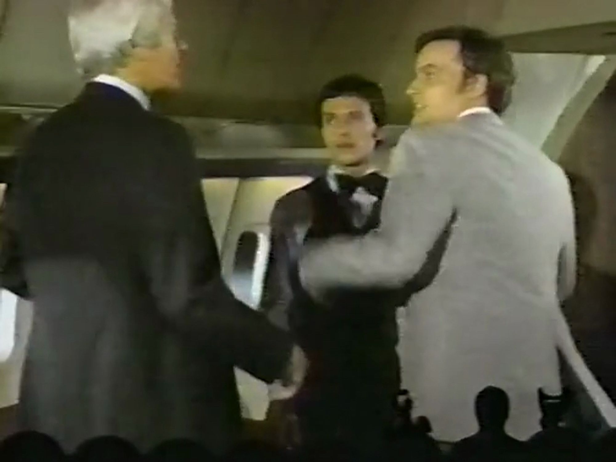 Here we see John de Lancie (Q from Star Trek: TNG) about to punch Peter Graves (Mission: Impossible and Biography). Graves used to date de Lancie's girlfriend, you see. But Graves is only there to stop him from harassing Billy Crystal (playing a gay-coded flight attendant).