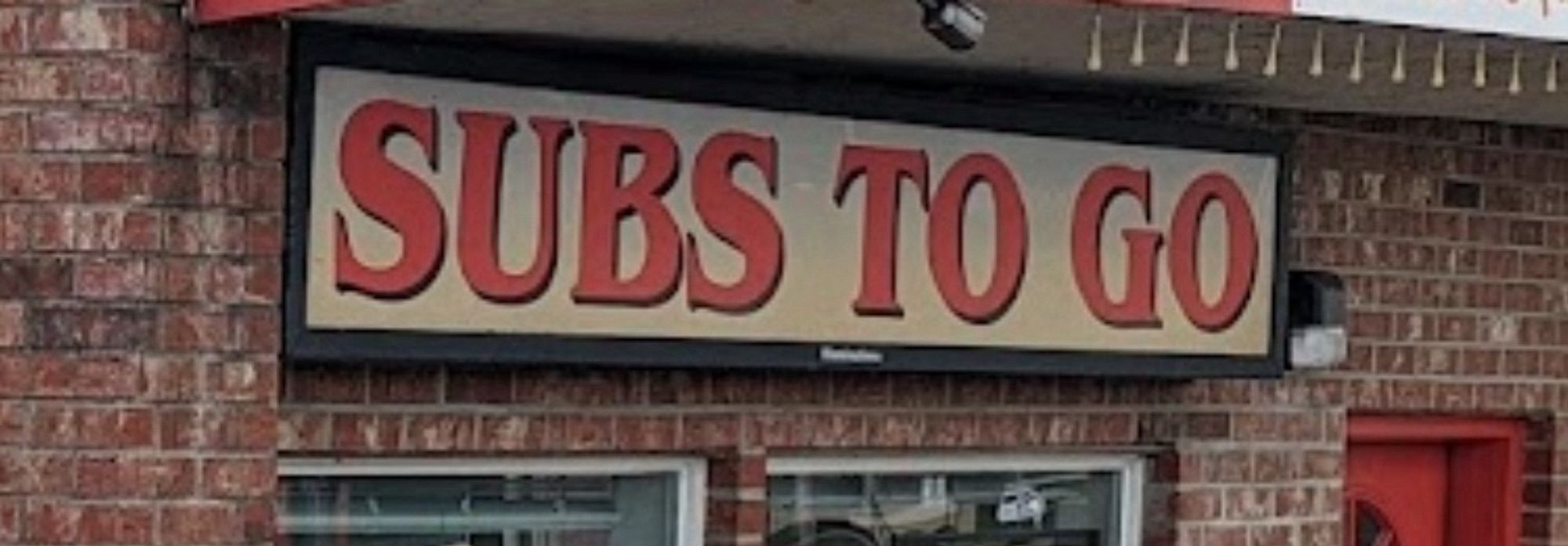 A sign that says “subs to go”