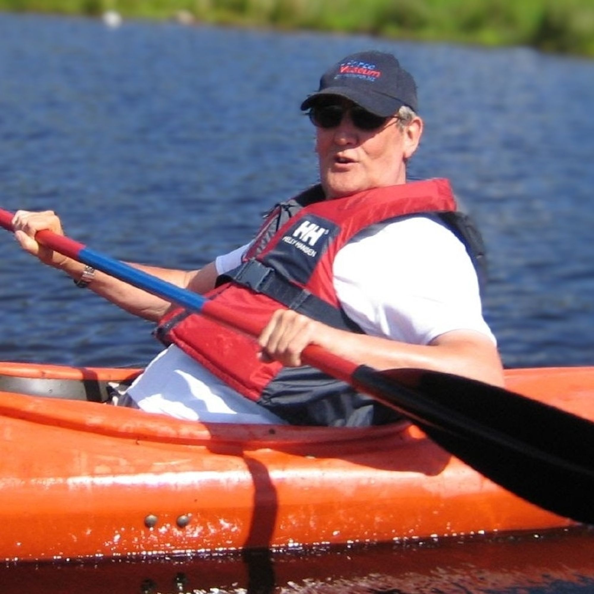 Man smiling in a kayak