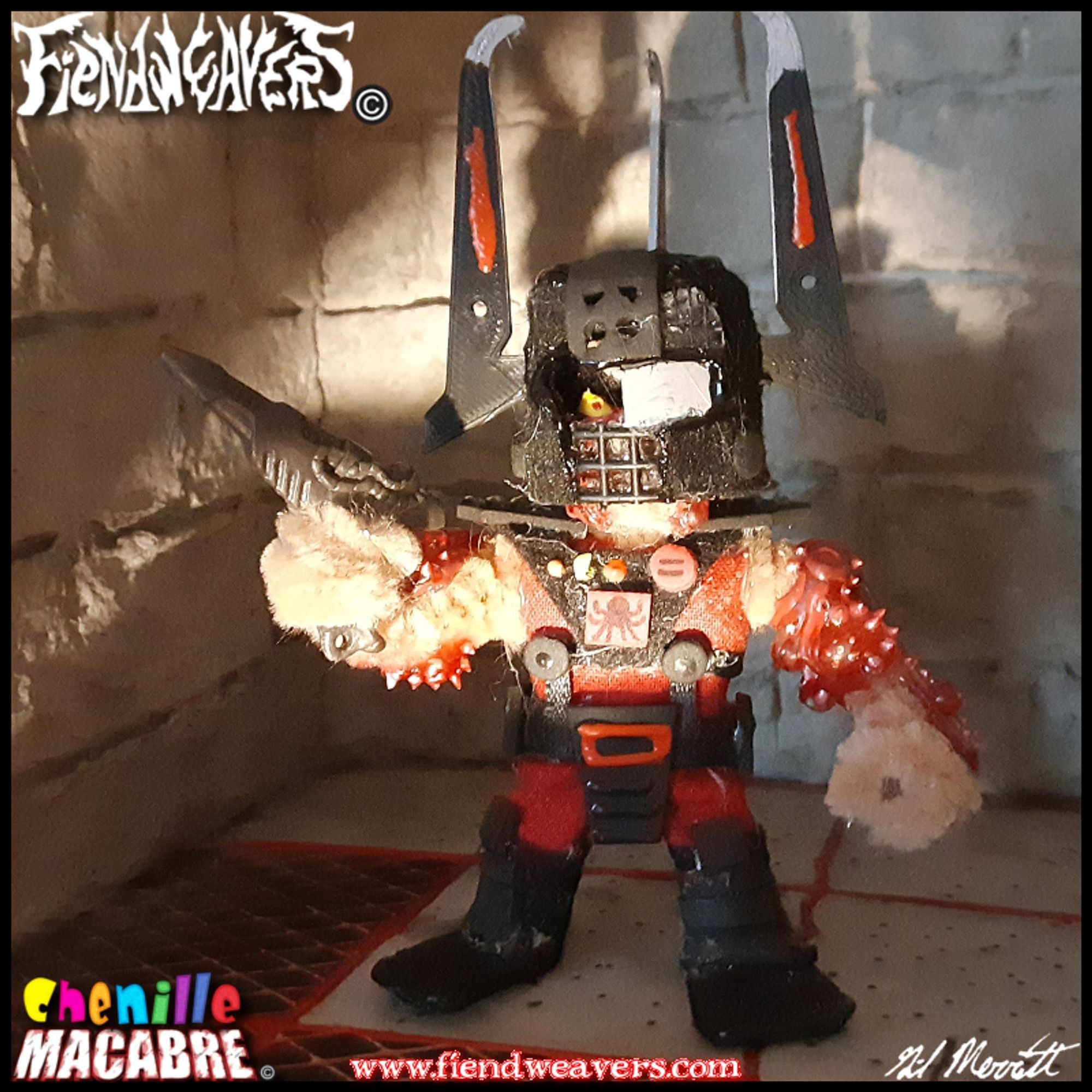 A pipe cleaner figure I built of Overlord from the cartoon SPIRAL ZONE. Overlord wears red-and-black combat fatigues and a three-horned helmet. His body is covered in boils. He stands 3" (7.62 cm) high and his arms and head are removable for AMPUTHEATRE combat.