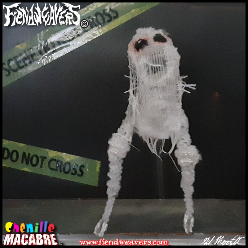 A pipe cleaner figure I built of the Fresno Nightcrawler. It is a white screaming biped with red-rimmed black eyes, wrapped in glued cheesecloth and "walks" by mean of a clear plastic dowel rod. Stands 3" (7.62 cm) high.