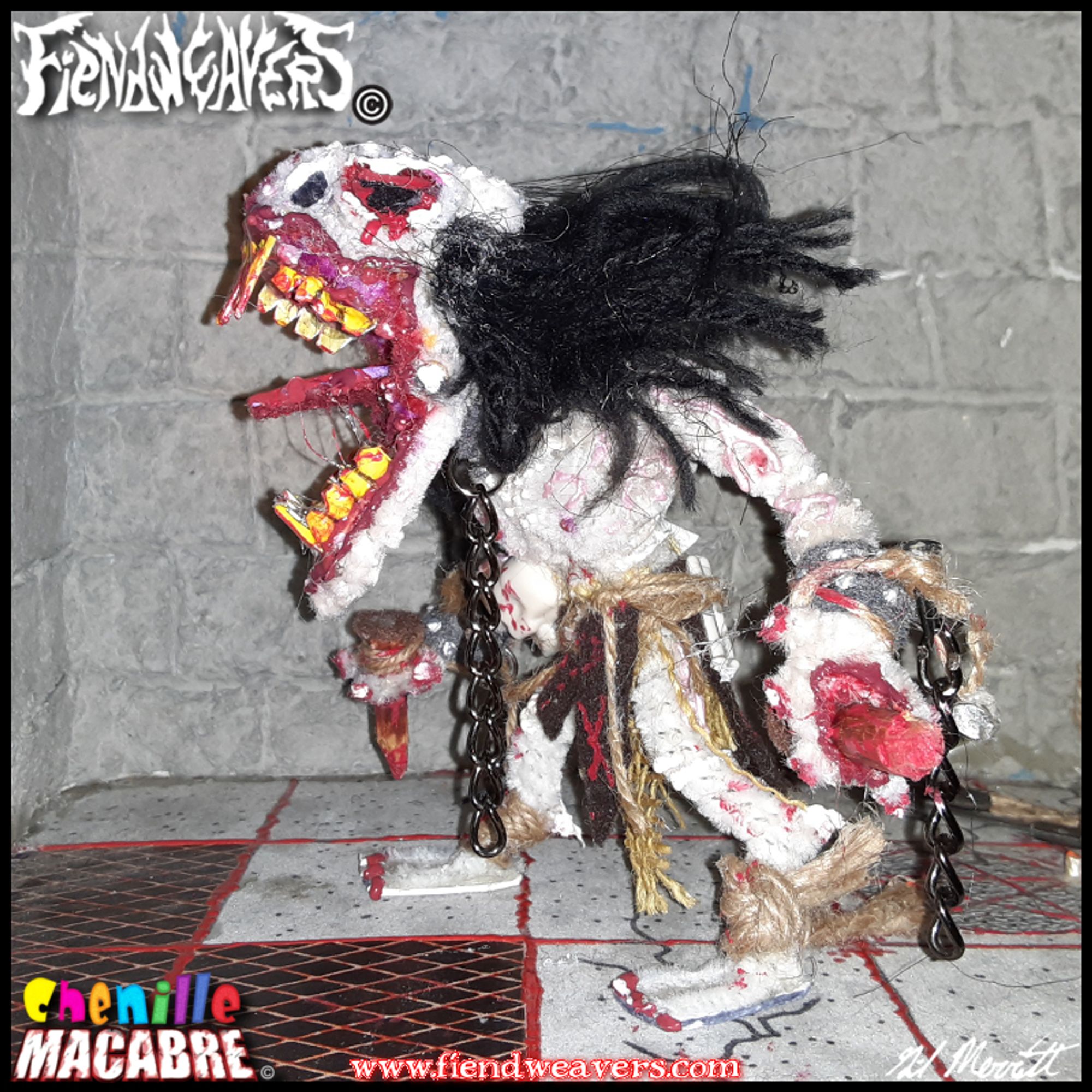 A pipe cleaner figure I built of Crucifiend, a playable fighter in my tabletop horror fighting game AMPUTHEATRE. Crucifiend is a nine-foot-tall pale monster with long black hair, no eyes, an enormous fanged maw, and stakes through its palms. This figure stands 5" (12.7 cm) high and its head and arms come off for AMPUTHEATRE combat.