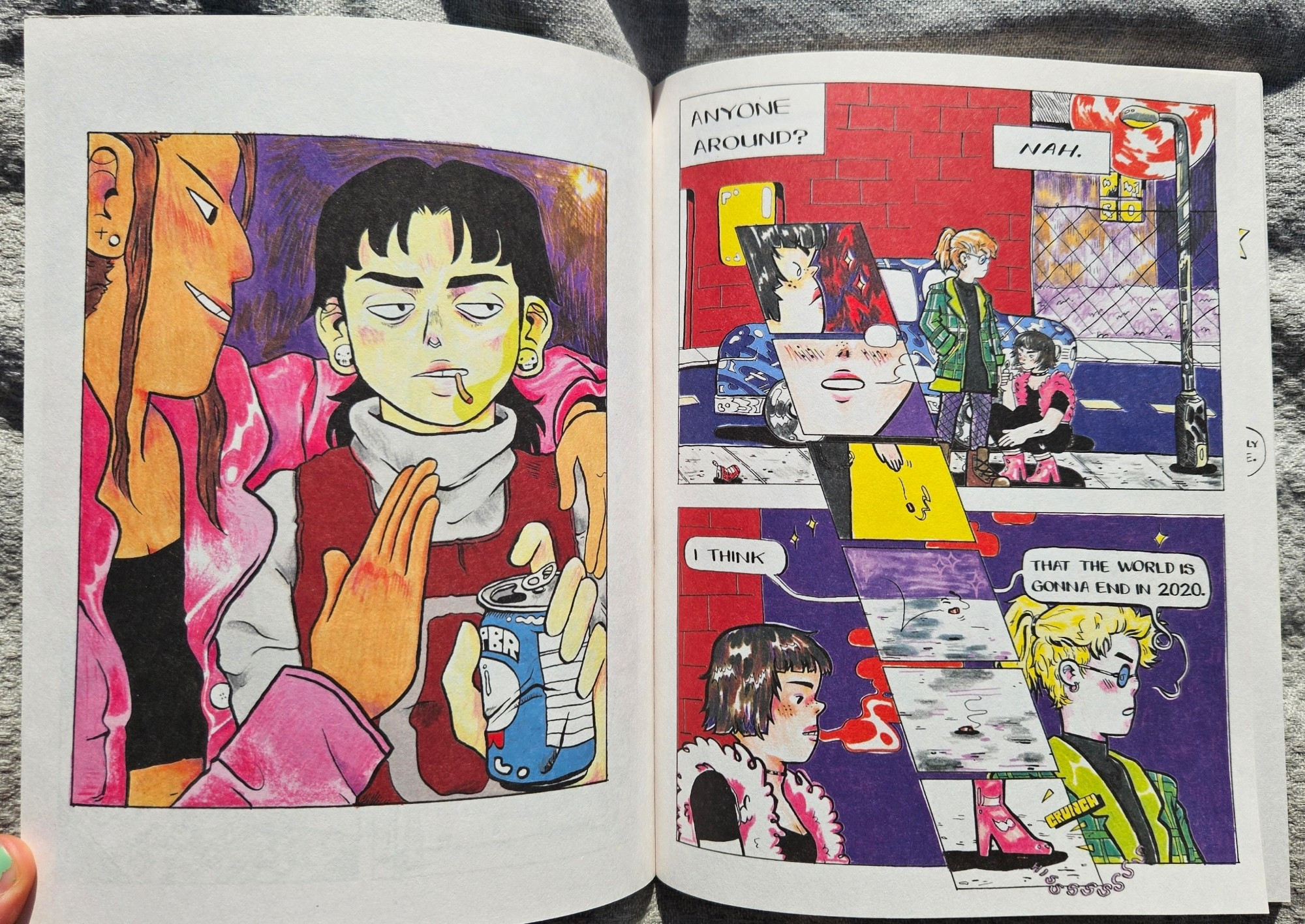 First two pages of "Girl in the World" - splash image of a character smoking and drinking a PBR, then a series of panels of two young women smoking surreptitiously. One says "I think that the world is going to end in 2020."