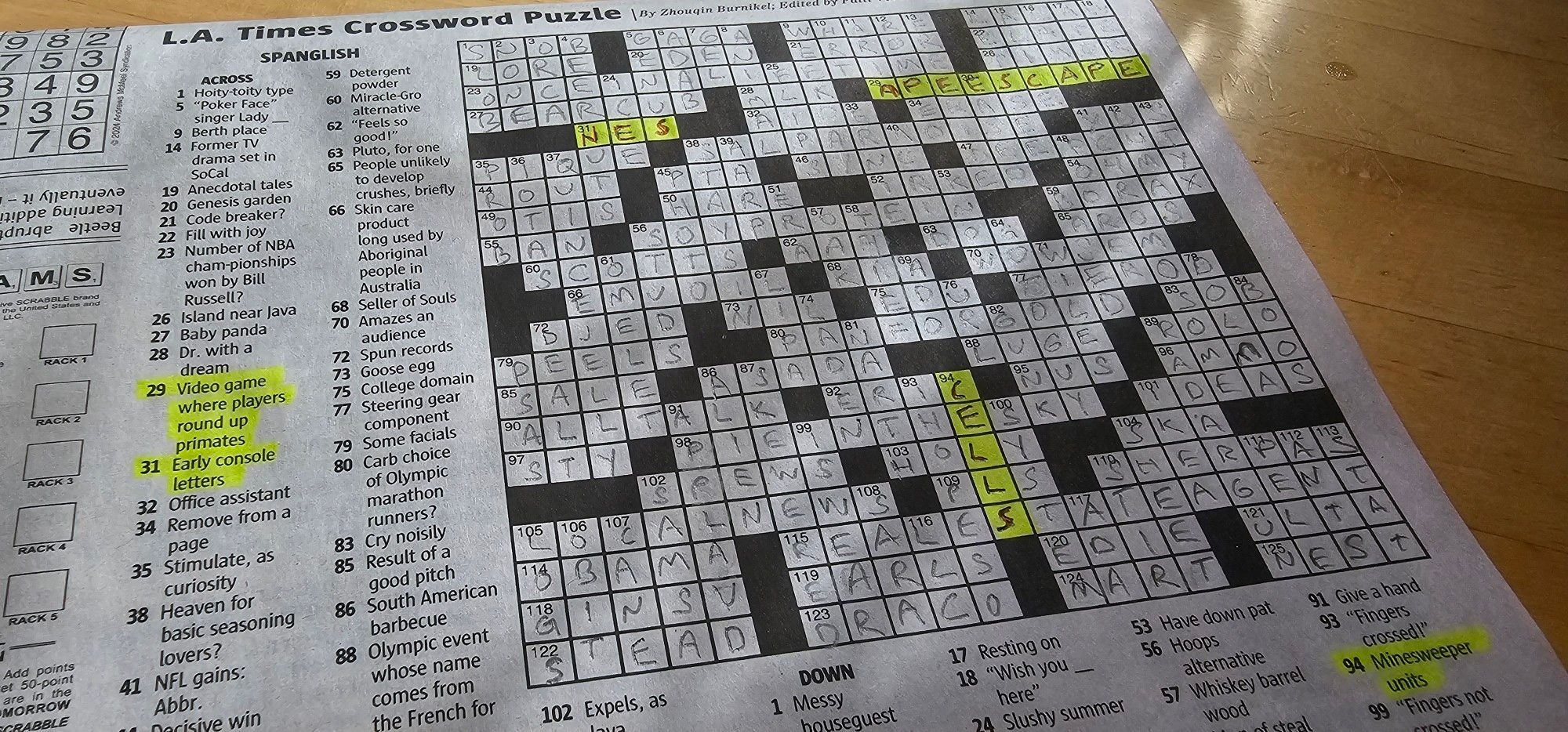 Crossword puzzle w 3 videogame related clues filled in, ape escape, nes, and cells (minesweeper)