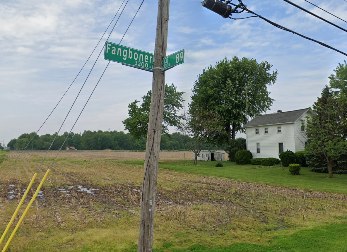 A street sign at an intersection in rural Ohio. One sign says CR 89, the other Fangboner Rd.