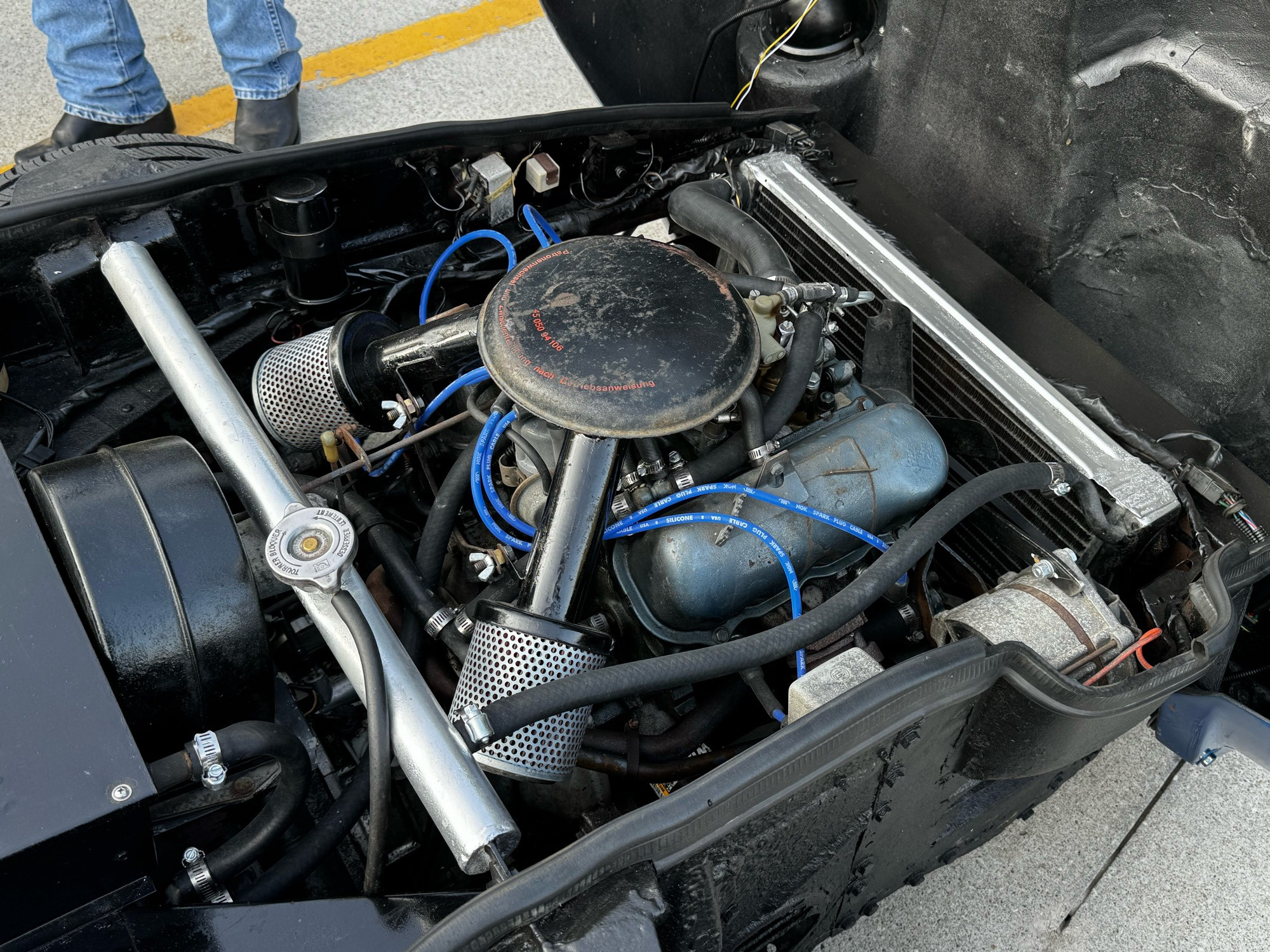 The engine bay of a Saab Sonnet, with a V4 engine displayed.