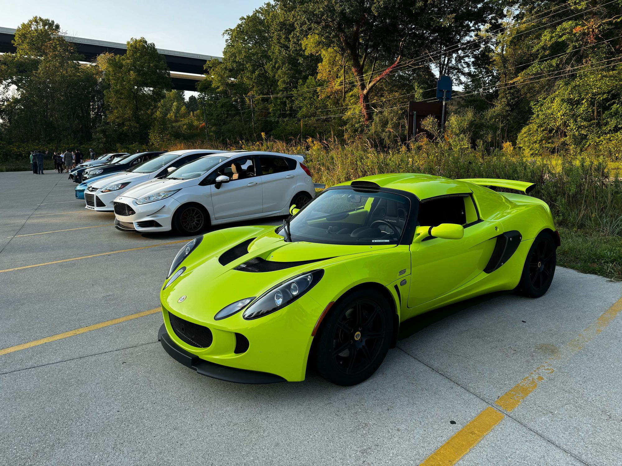 A bright neon yellow Lotus Exige.