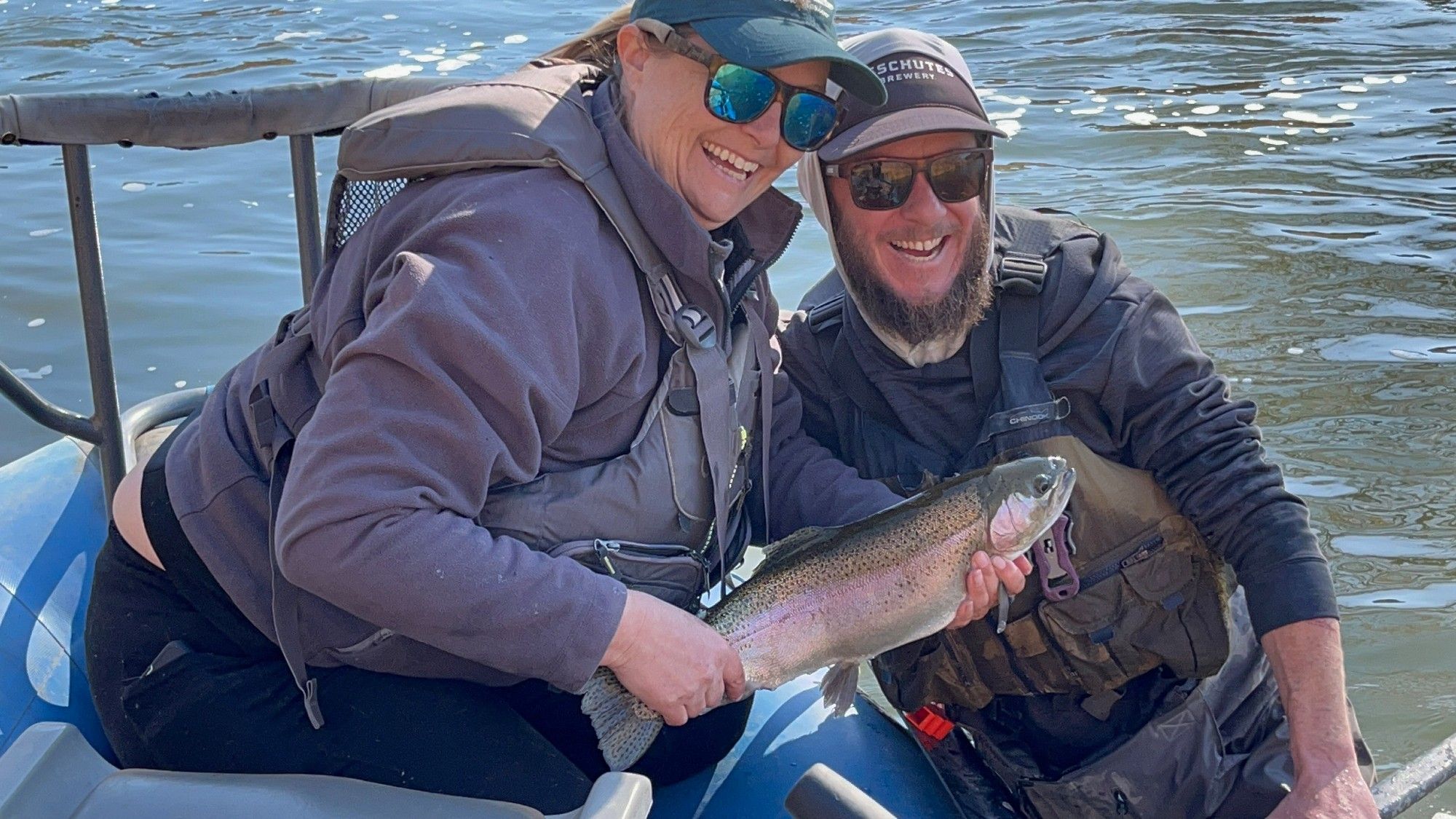 Myself and the guide who has been patiently helping me get better at flyfishing with the largest fish I've ever caught.  It's an about 18inch cutbow (rainbow cutthroat trout hybrid). I have a shit eating grin of excitement on my face.