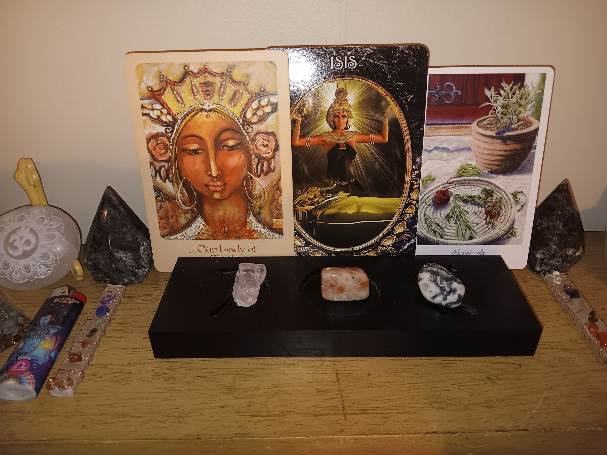 L-R. Mother Mary: Our Lady of Truth; Danburite
Dark Goddess: Isis; Sunstone
Herbcrafter's Tarot: 5 of Air, White Sage; Tree agate