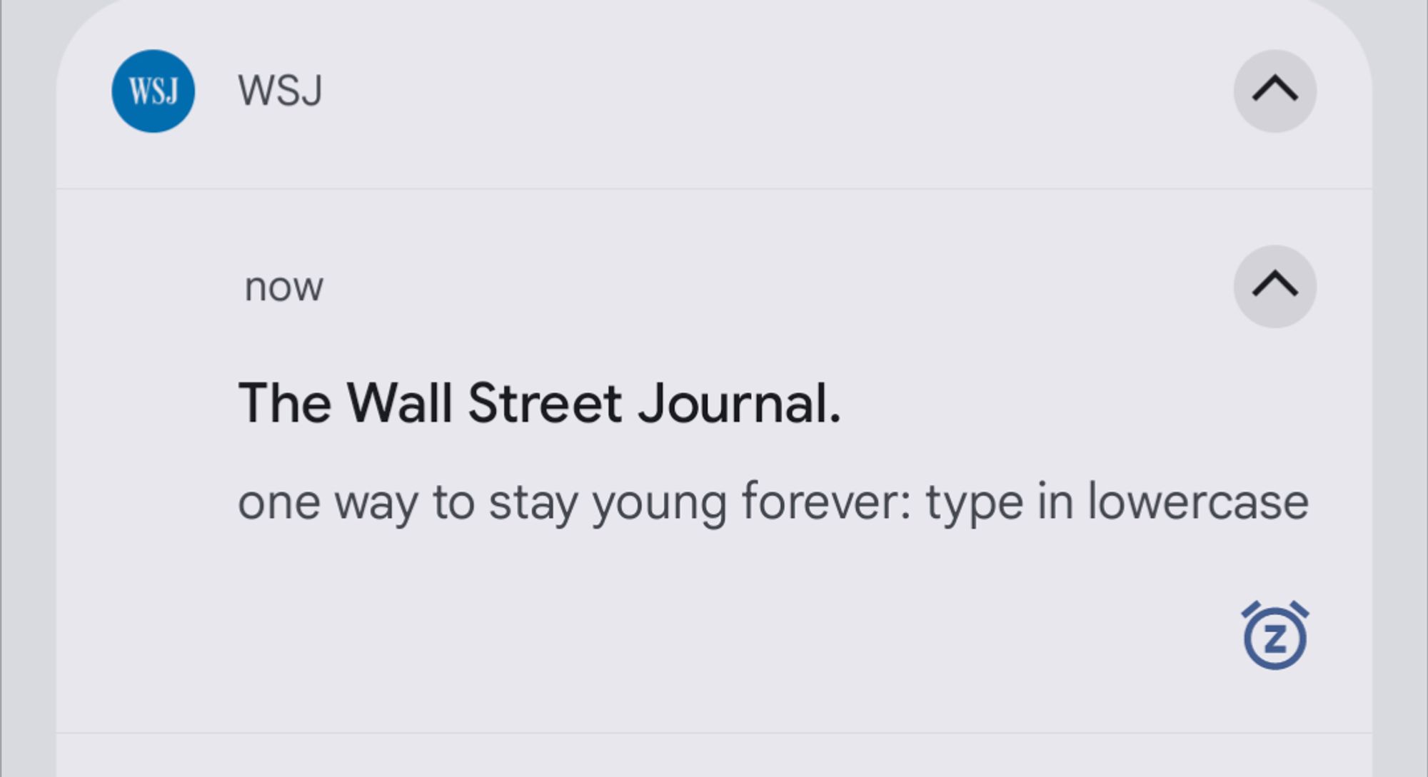 A WJS notification whose headline, in all lowercase, is "one way to stay young forever: type in lowercase."